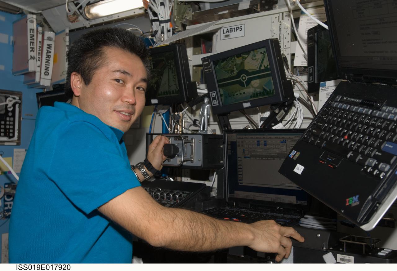 ISS019-E-017920 (19 May 2009) --- Japan Aerospace Exploration Agency (JAXA) astronaut Koichi Wakata, Expedition 19/20 flight engineer, works controls at the station?s Canadarm2 robotic arm in the Destiny laboratory of the International Space Station.