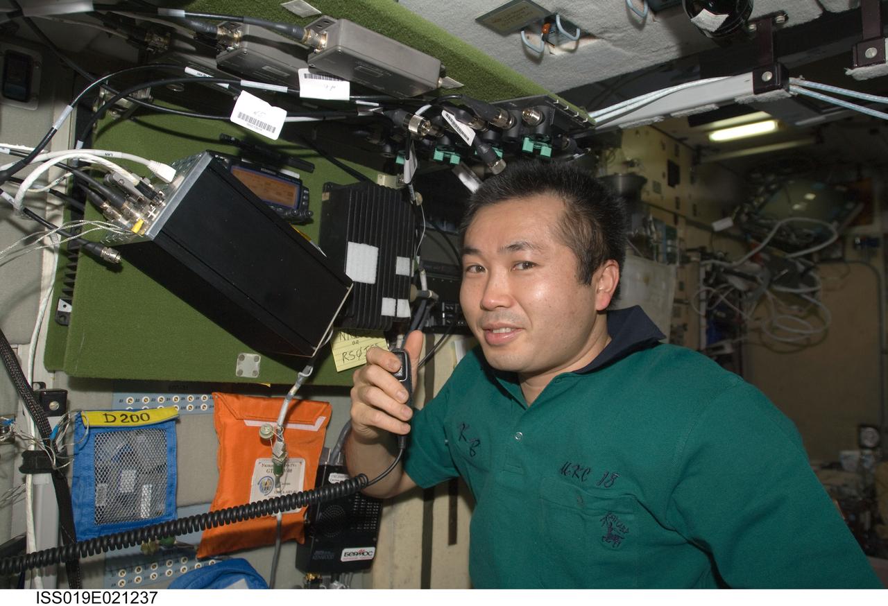 ISS019-E-021237 (26 May 2009) --- Japan Aerospace Exploration Agency (JAXA) astronaut Koichi Wakata, Expedition 19/20 flight engineer, uses an amateur radio in the Zvezda Service Module of the International Space Station.