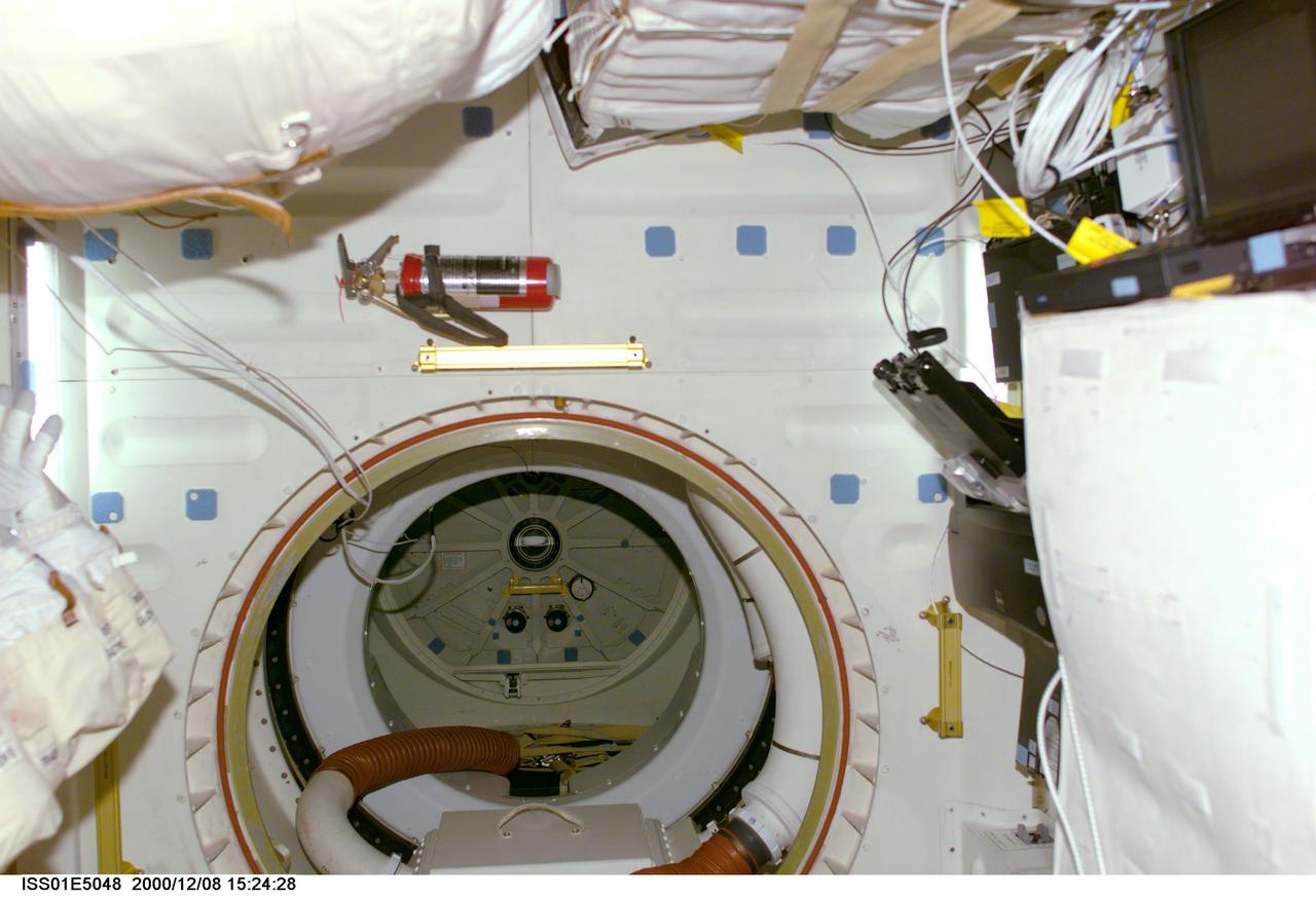 ISS01-E-5048 (8 December 2000) ---This digital still camera's view was taken in the International Space Station's Primary Mating Adapter-3 (PMA-3) looking into the tunnel that leads to the Unity node.