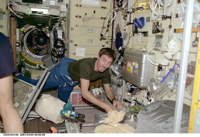 NASA image: Krikalev in Service module with tools