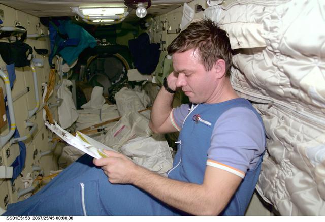 NASA image: Gidzenko reviews checklist in the FGB/Zarya module