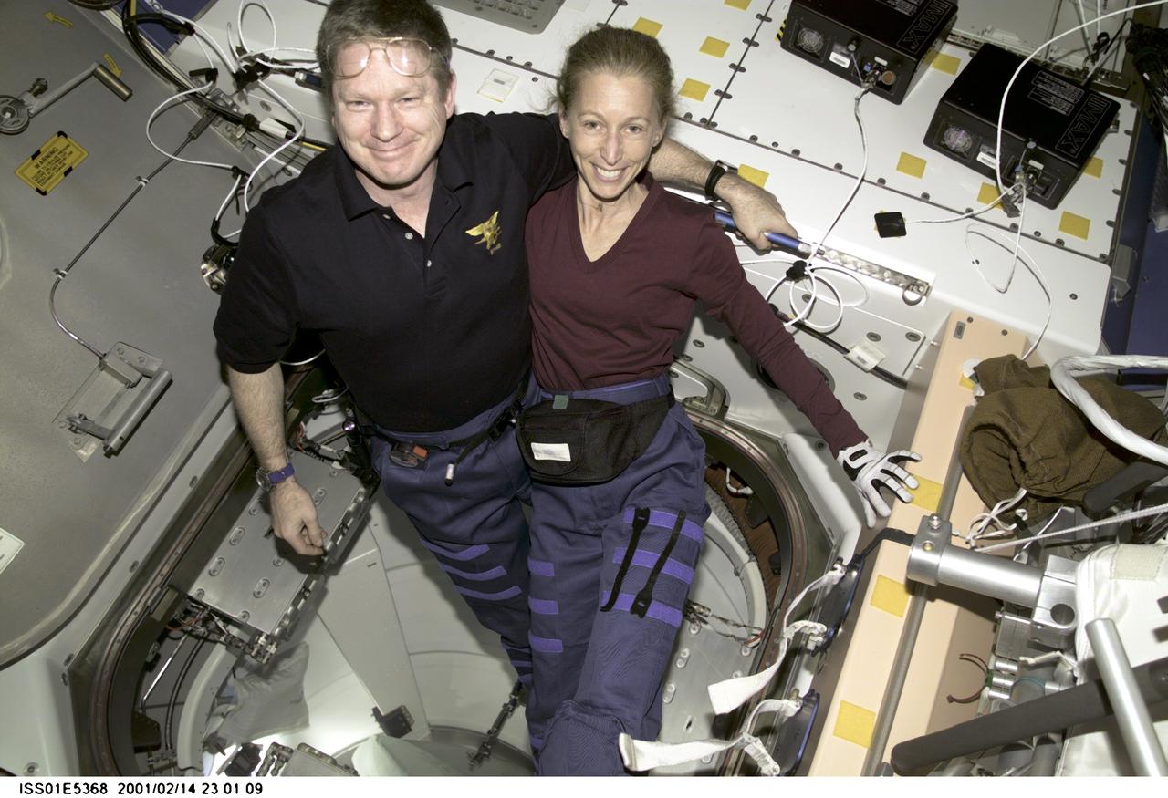 ISS01-E-5368 (14 February 2001) --- Onboard the new Destiny laboratory, Expedition One commander William M. (Bill) Shepherd, shares a brief break from a busy work agenda with astronaut Marsha S. Ivins, STS-98 mission specialist. The two are alumni of the tenth class of NASA astronaut candidates, having come aboard with 15 other trainees in the summer of 1984.