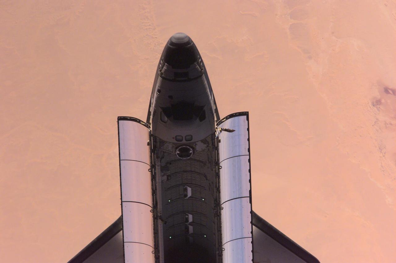 ISS01-E-5387 (16 February 2001) --- This nadir image of the Space Shuttle Atlantis backdropped over the western Sahara Desert was photographed by the three-man Expedition One crew aboard the International Space Station (ISS) shortly after the shuttle and the outpost unlinked following several days of joint operations of the two crews. The scene was recorded with a digital still camera.