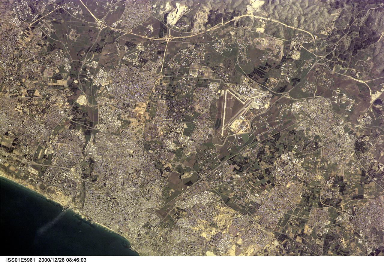 ISS001-E-5981 (28 December 2000) ---  A near-vertical digital still image from the International Space Station (ISS)  features Tel Aviv-Yafo, Israel.  A small section of the Mediterranean Sea  coastline is at bottom left.  One of the Expedition One crew members used an extender on a 400mm lens to provide   detail in the image.  Onboard the outpost for the first habitation tour  were astronaut William M. (Bill) Shepherd, commander; along with cosmonauts Yuri P. Gidzenko, Soyuz commander; and Sergei K. Krikalev,  flight engineer.