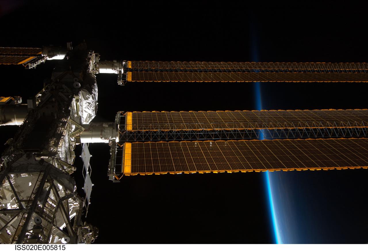 ISS020-E-005815 (31 May 2009) --- Backdropped by the thin line of Earth's atmosphere and the blackness of space, a portion of the International Space Station is featured in this image photographed by an Expedition 20 crew member aboard the station.