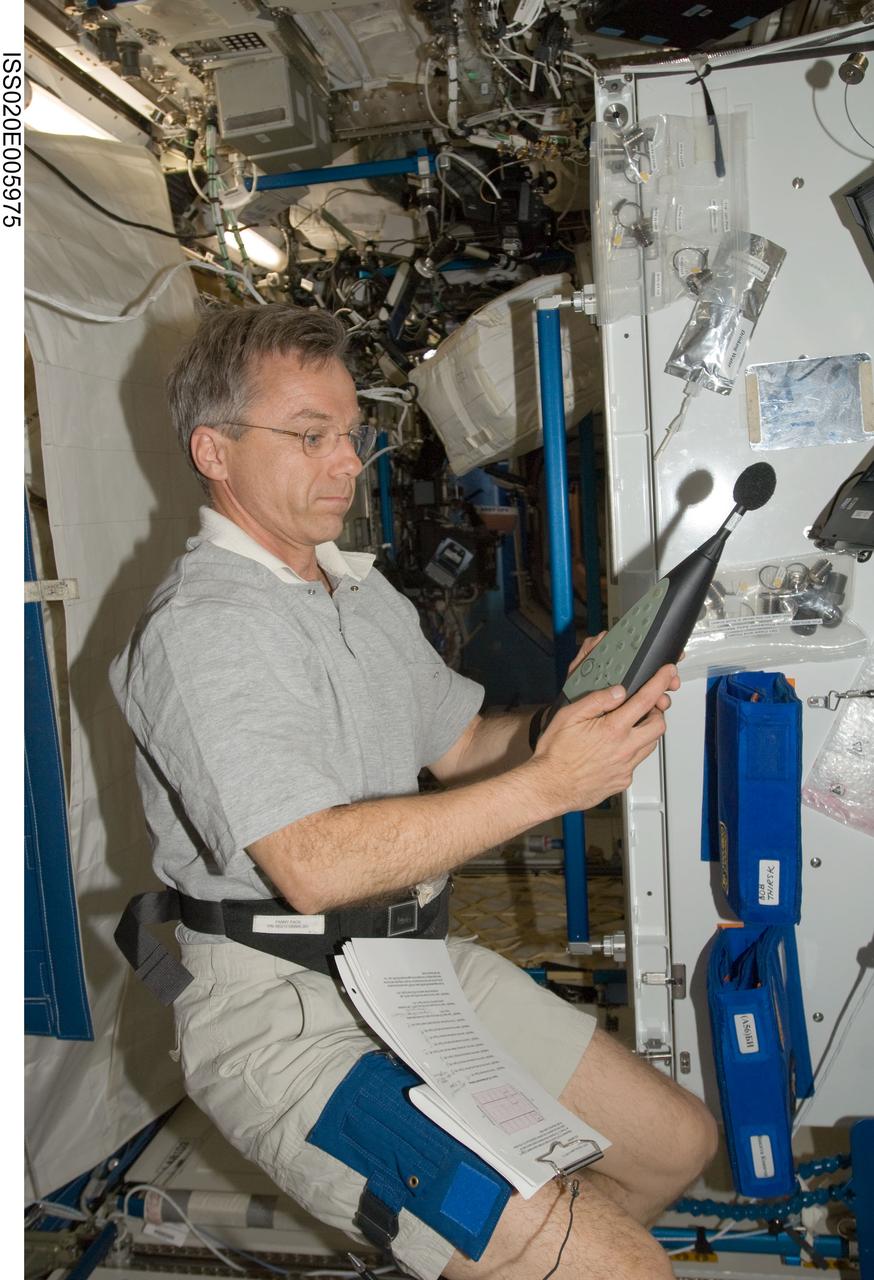 ISS020-E-005975 (2 June 2009) --- Canadian Space Agency astronaut Robert Thirsk, Expedition 20 flight engineer, works with a U.S. Sound Level Meter (SLM) for Setup and Acoustic Survey in the Destiny laboratory of the International Space Station.
