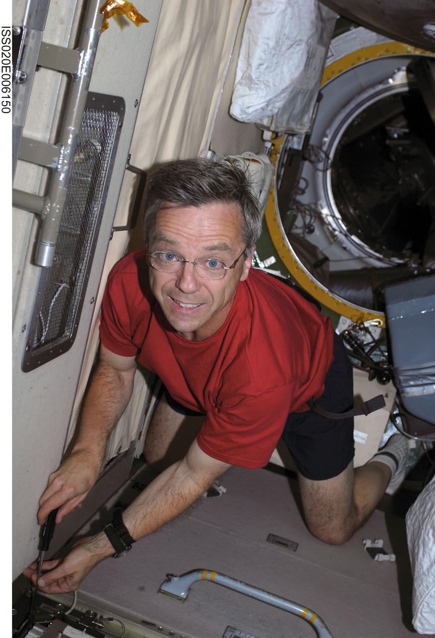 ISS020-E-006150 (3 June 2009) --- Canadian Space Agency astronaut Robert Thirsk, Expedition 20 flight engineer, performs in-flight maintenance in the Zvezda Service Module of the International Space Station.