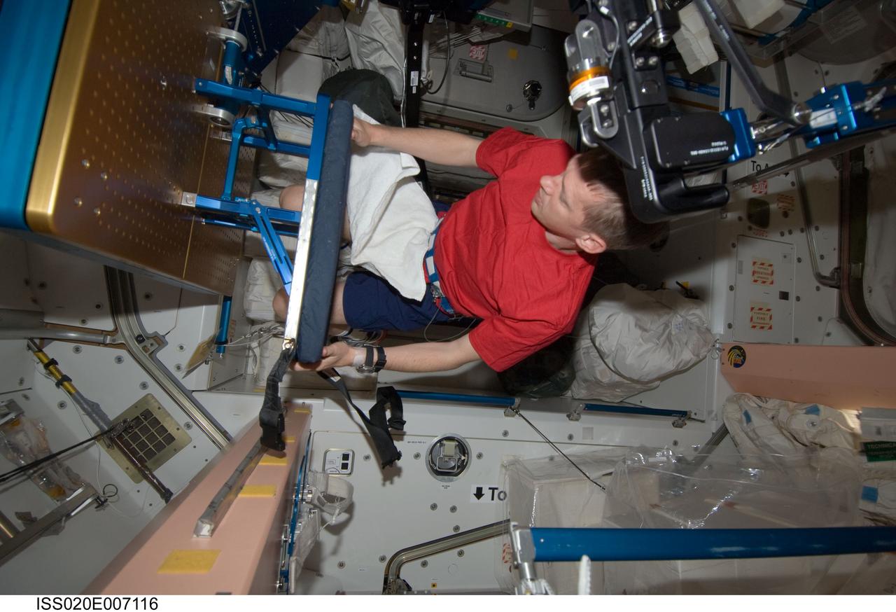 ISS020-E-007116 (5 June 2009) --- European Space Agency astronaut Frank De Winne, Expedition 20 flight engineer, prepares to use the advanced Resistive Exercise Device (aRED) in the Unity node of the International Space Station.