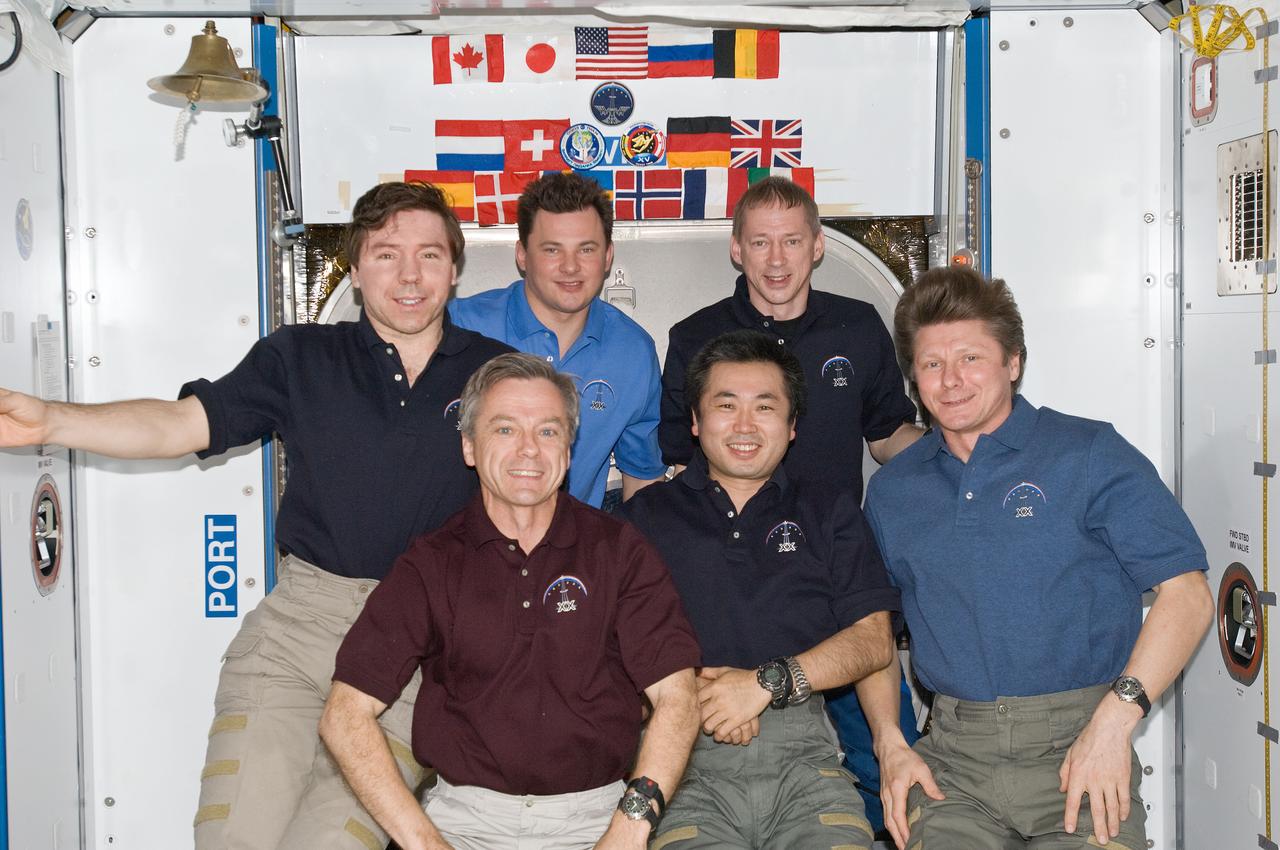 ISS020-E-008893 (14 June 2009) --- The six-person Expedition 20 crew poses for an in-flight portrait in the Harmony node of the International Space Station. Pictured from the left (front row) are Canadian Space Agency astronaut Robert Thirsk, Japan Aerospace Exploration Agency (JAXA) astronaut Koichi Wakata, both flight engineers; and cosmonaut Gennady Padalka, commander. From the left (back row) are NASA astronaut Michael Barratt, cosmonaut Roman Romanenko and European Space Agency astronaut Frank De Winne, all flight engineers.