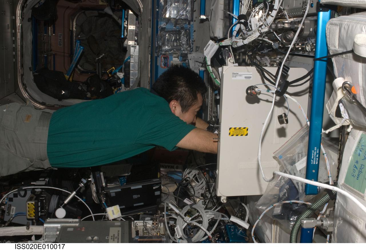 ISS020-E-010017 (15 June 2009) --- Japan Aerospace Exploration Agency (JAXA) astronaut Koichi Wakata, Expedition 20 flight engineer, works with the General Laboratory Active Cryogenic ISS Experiment Refrigerator (GLACIER) in the Destiny laboratory of the International Space Station.
