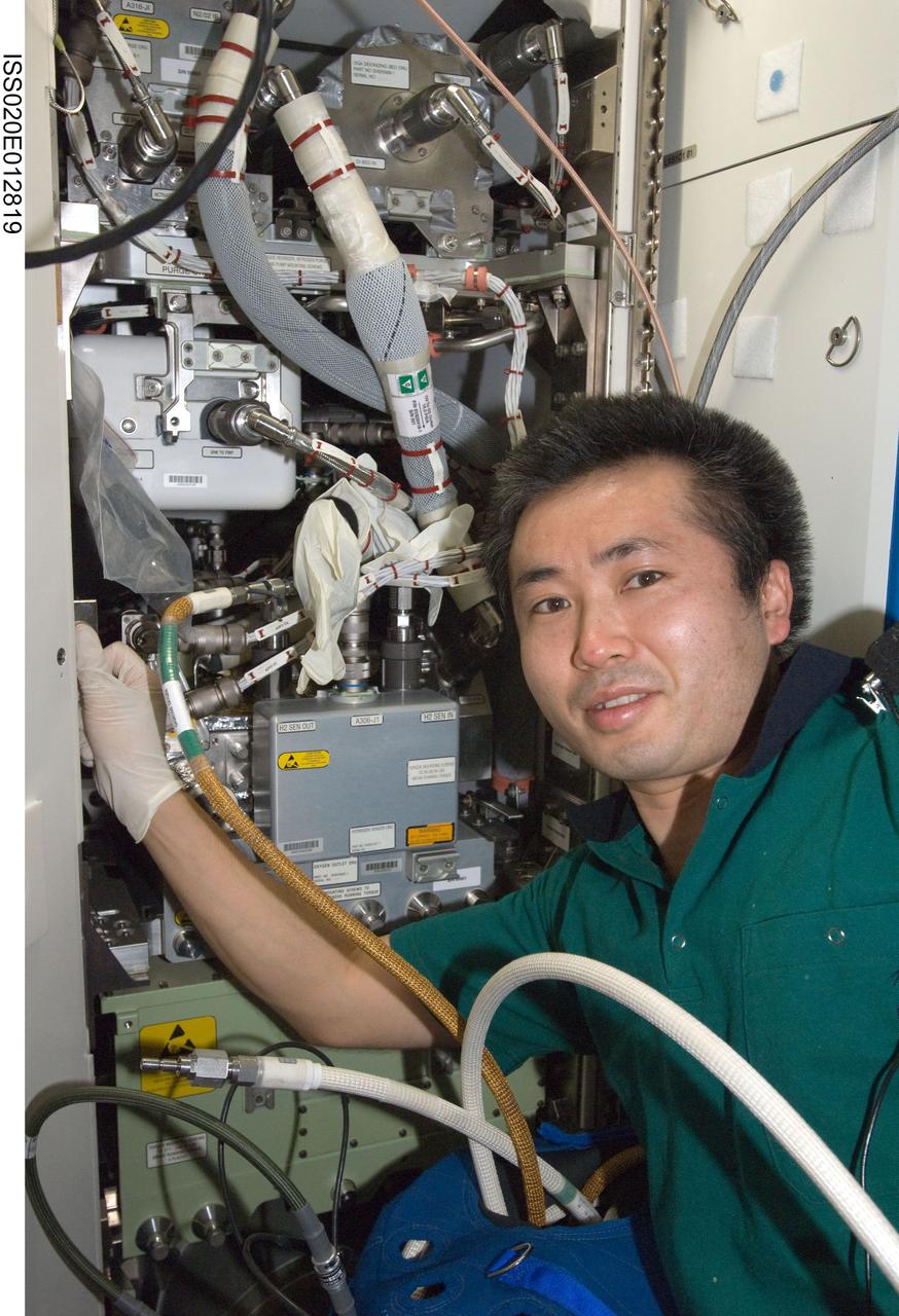 ISS020-E-012819 (22 June 2009) --- Japan Aerospace Exploration Agency (JAXA) astronaut Koichi Wakata, Expedition 20 flight engineer, performs in-flight maintenance on the Oxygen Generator System (OGS) in the Destiny laboratory of the International Space Station.