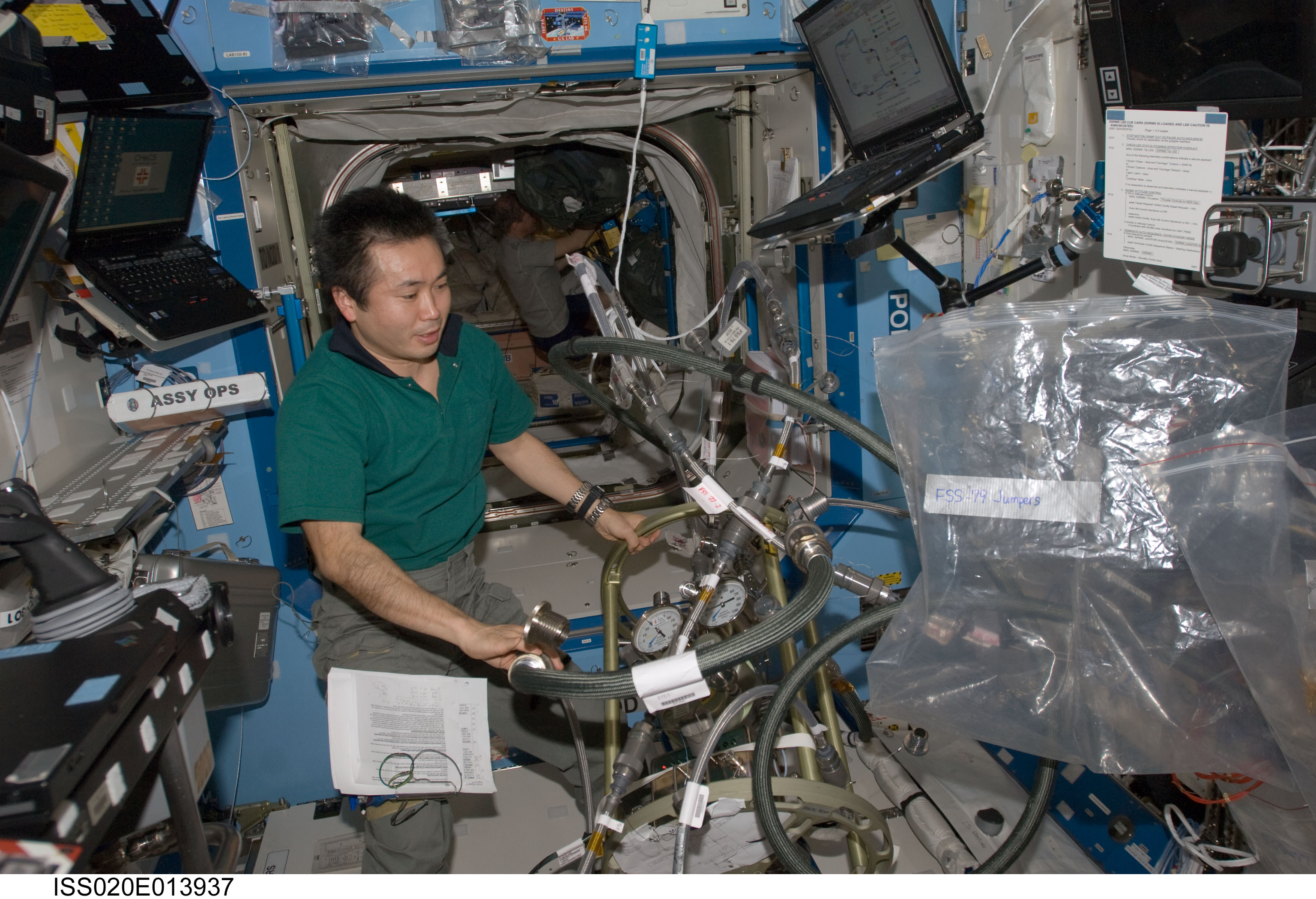 ISS020-E-013937 (23 June 2009) --- Japan Aerospace Exploration Agency (JAXA) astronaut Koichi Wakata, Expedition 20 flight engineer, works with the Fluid Control Pump Assembly (FCPA), which is a part of the Internal Thermal Control System (ITCS) in the Destiny laboratory on the International Space Station.