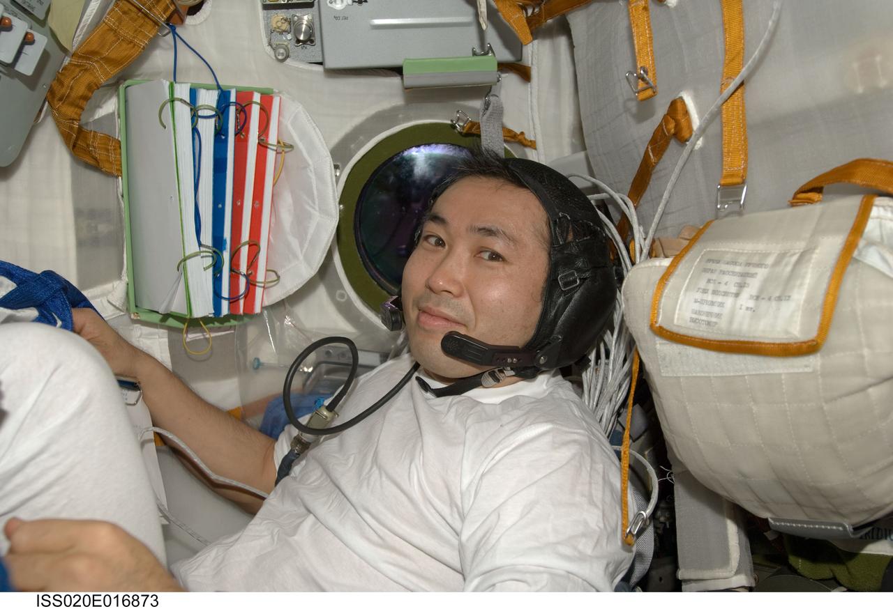 ISS020-E-016873 (2 July 2009) --- Japan Aerospace Exploration Agency (JAXA) astronaut Koichi Wakata, Expedition 20 flight engineer, is pictured in the Soyuz TMA-14 spacecraft during preparations for the relocation of the Soyuz from the Zvezda Service Module’s aft port to the Pirs Docking Compartment of the International Space Station.