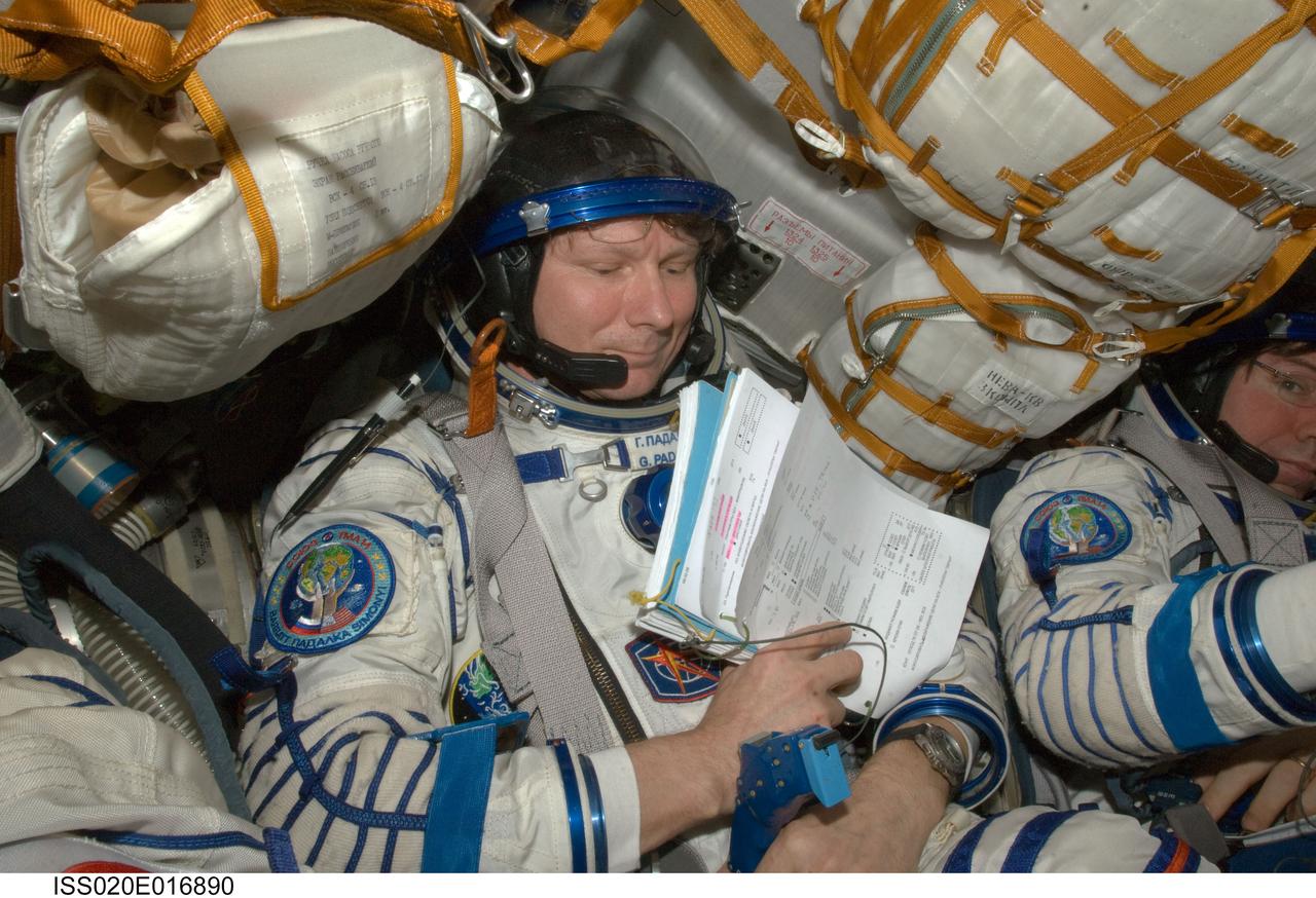 ISS020-E-016890 (2 July 2009) --- Cosmonaut Gennady Padalka, Expedition 20 commander, attired in a Russian Sokol launch and entry suit, occupies his seat in the Soyuz TMA-14 during final preparations for the relocation of the Soyuz from the Zvezda Service Module’s aft port to the Pirs Docking Compartment of the International Space Station.