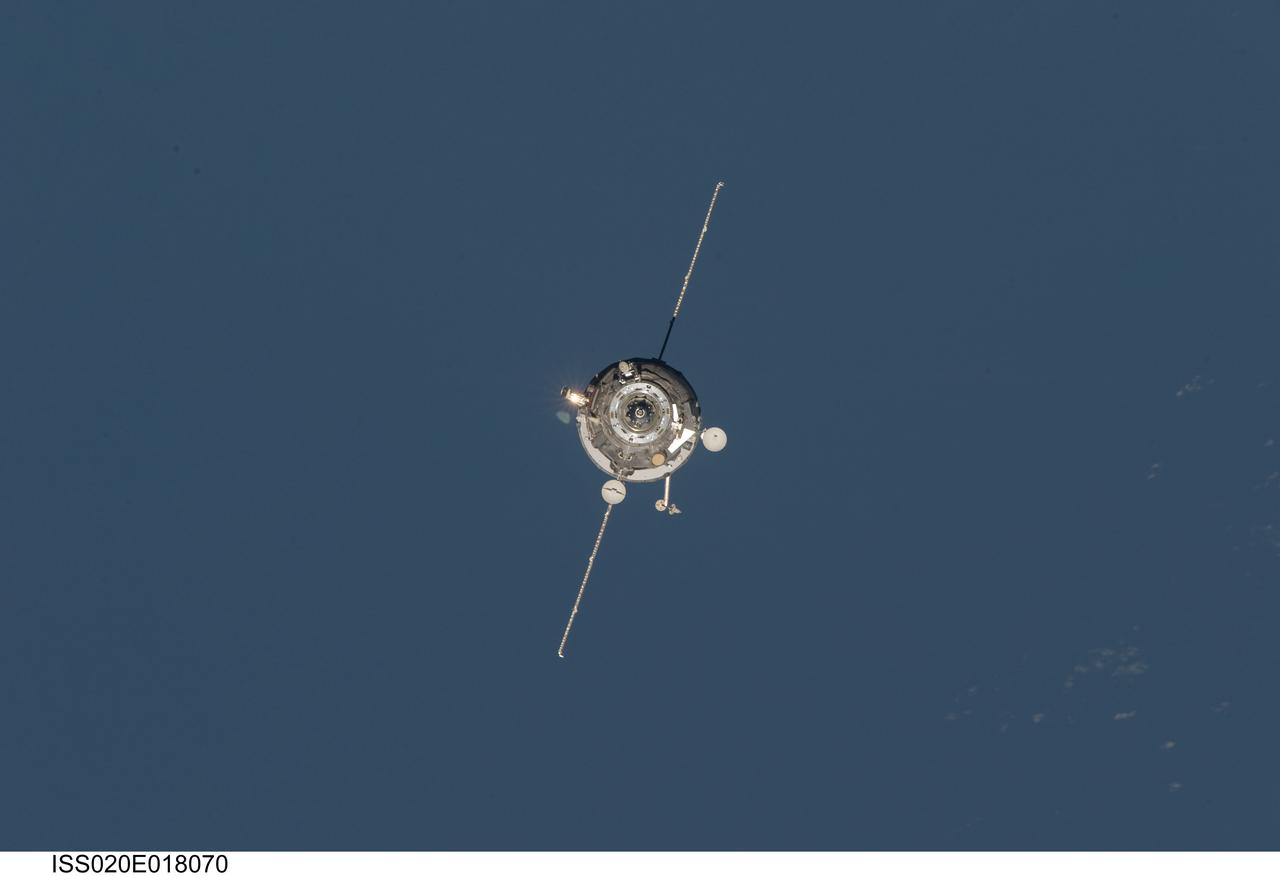 ISS020-E-018070 (12 July 2009) --- An unpiloted ISS Progress 33 cargo craft approaches the International Space Station. On June 30, the Progress undocked from the station and was commanded into a parking orbit for its re-rendezvous with the ISS on July 12, approaching to within 10-15 meters of the Zvezda Service Module to test new automated rendezvous equipment mounted on Zvezda during a pair of spacewalks earlier this month by Gennady Padalka and Mike Barratt that will be used to guide the new Mini-Research Module-2 (MRM2) to an unpiloted docking to the zenith port of Zvezda later this year. MRM2 will serve as a new docking port for Russian spacecraft and an additional airlock for spacewalks conducted out of the Russian segment.