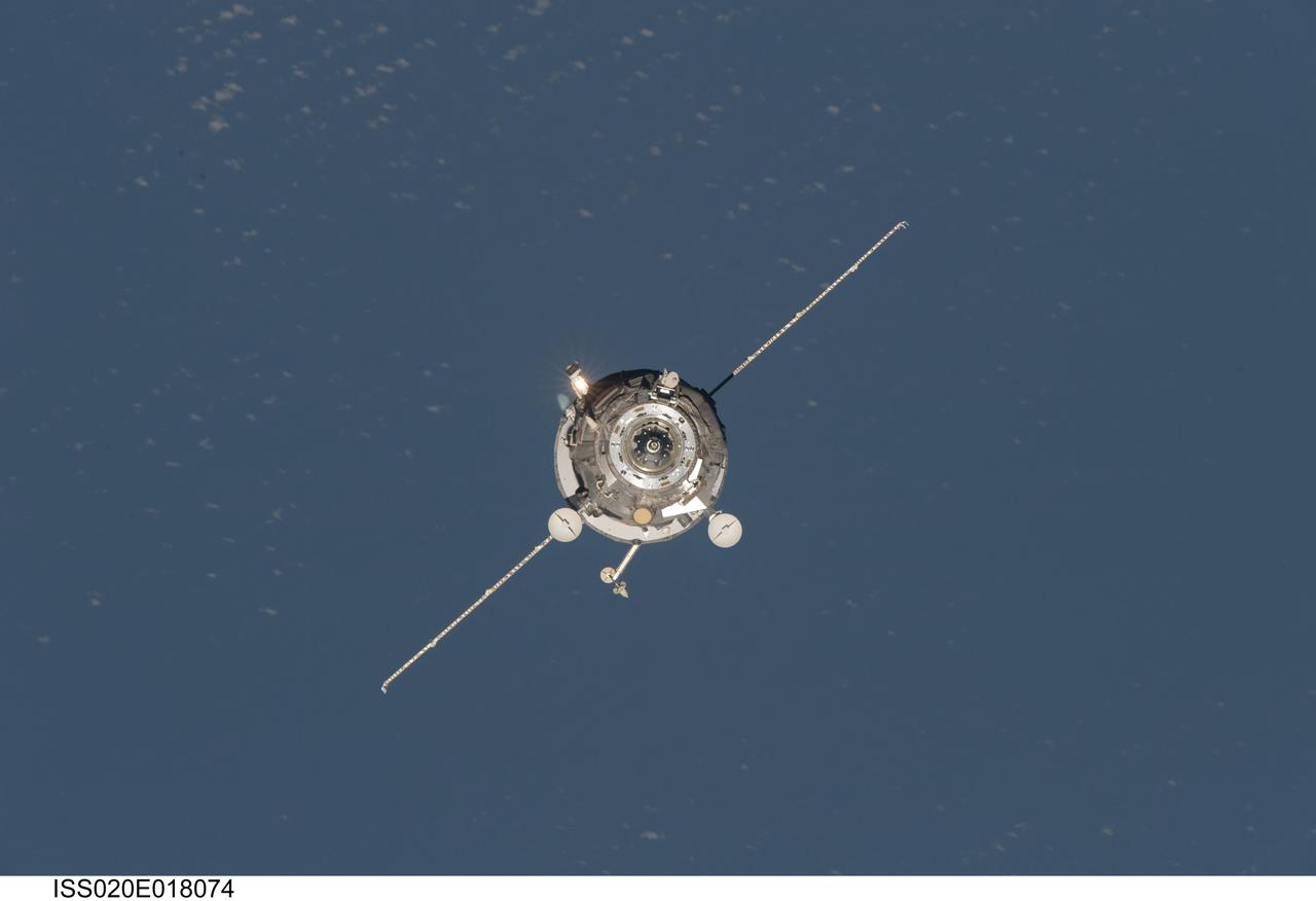 ISS020-E-018074 (12 July 2009) --- An unpiloted ISS Progress 33 cargo craft approaches the International Space Station. On June 30, the Progress undocked from the station and was commanded into a parking orbit for its re-rendezvous with the ISS on July 12, approaching to within 10-15 meters of the Zvezda Service Module to test new automated rendezvous equipment mounted on Zvezda during a pair of spacewalks earlier this month by Gennady Padalka and Mike Barratt that will be used to guide the new Mini-Research Module-2 (MRM2) to an unpiloted docking to the zenith port of Zvezda later this year. MRM2 will serve as a new docking port for Russian spacecraft and an additional airlock for spacewalks conducted out of the Russian segment.