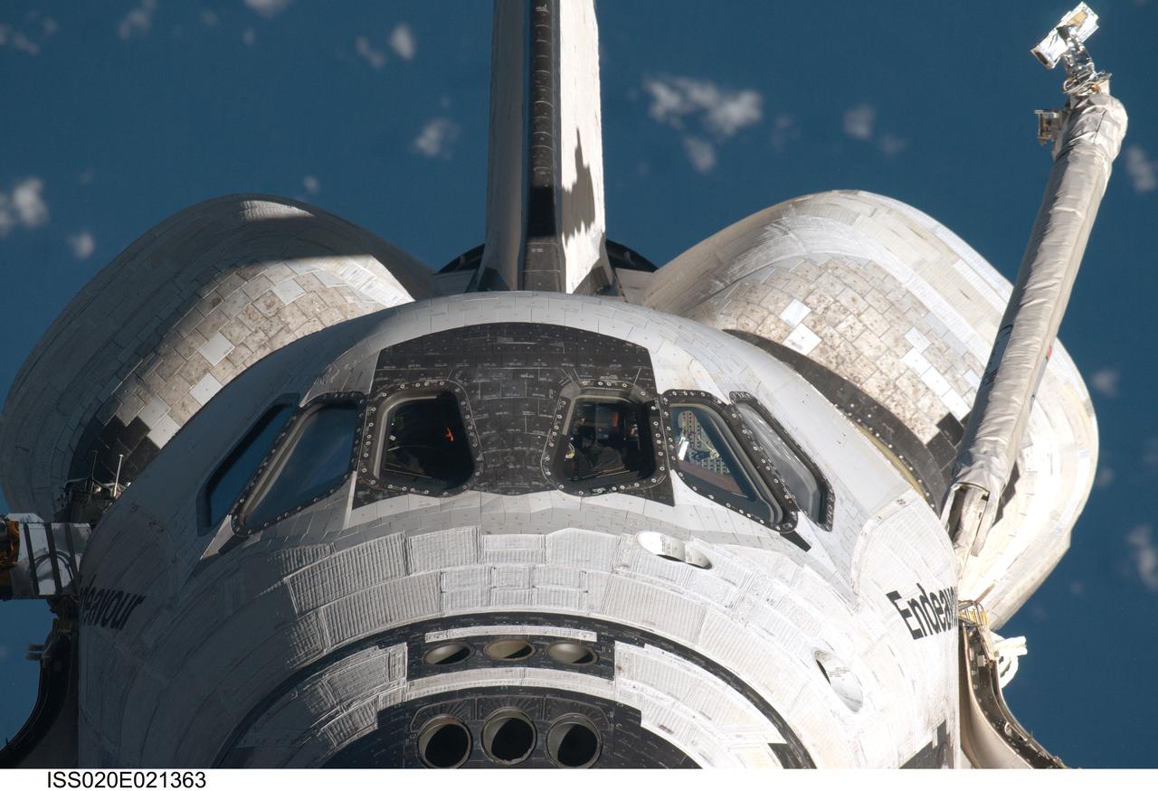 ISS20-E-021363 (17 July 2009) --- This  head-on view of the Space Shuttle Endeavour was provided by an Expedition 20 crewmember during a survey of the approaching vehicle prior to docking with the International Space Station. As part of the survey and part of every mission's activities, Endeavour performed a back-flip for the rendezvous pitch maneuver (RPM). The image was photographed with a digital still camera, using a 800mm lens at a distance of about 600 feet (180 meters).