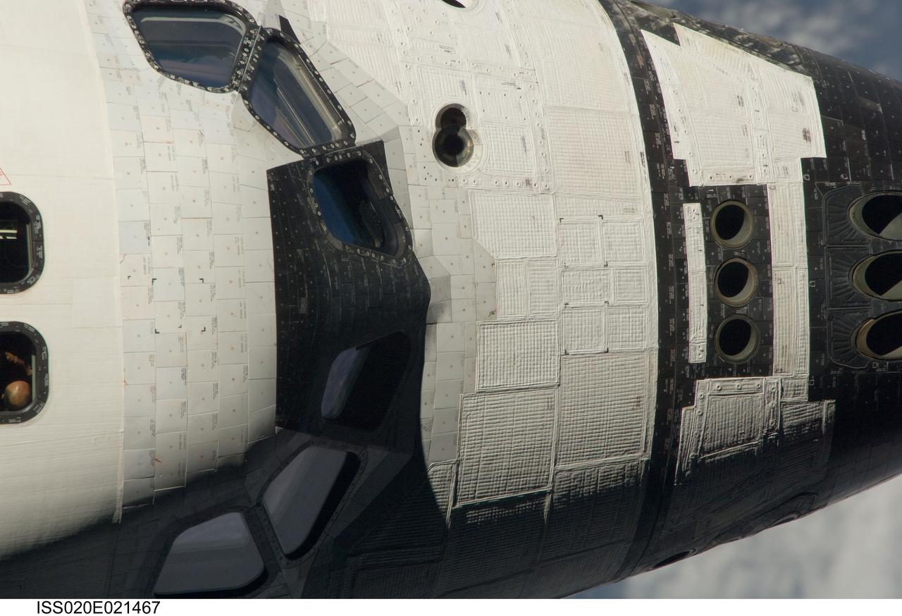 ISS020-E-021467 (17 July 2009) --- This view of the crew cabin of the Space Shuttle Endeavour was provided by an Expedition 20 crewmember during a survey of the approaching vehicle prior to docking with the International Space Station. As part of the survey and part of every mission's activities, the STS-127 Endeavour crew performed a back-flip for the rendezvous pitch maneuver (RPM). The image was photographed with a digital still camera, using a 800mm lens at a distance of about 600 feet (180 meters).