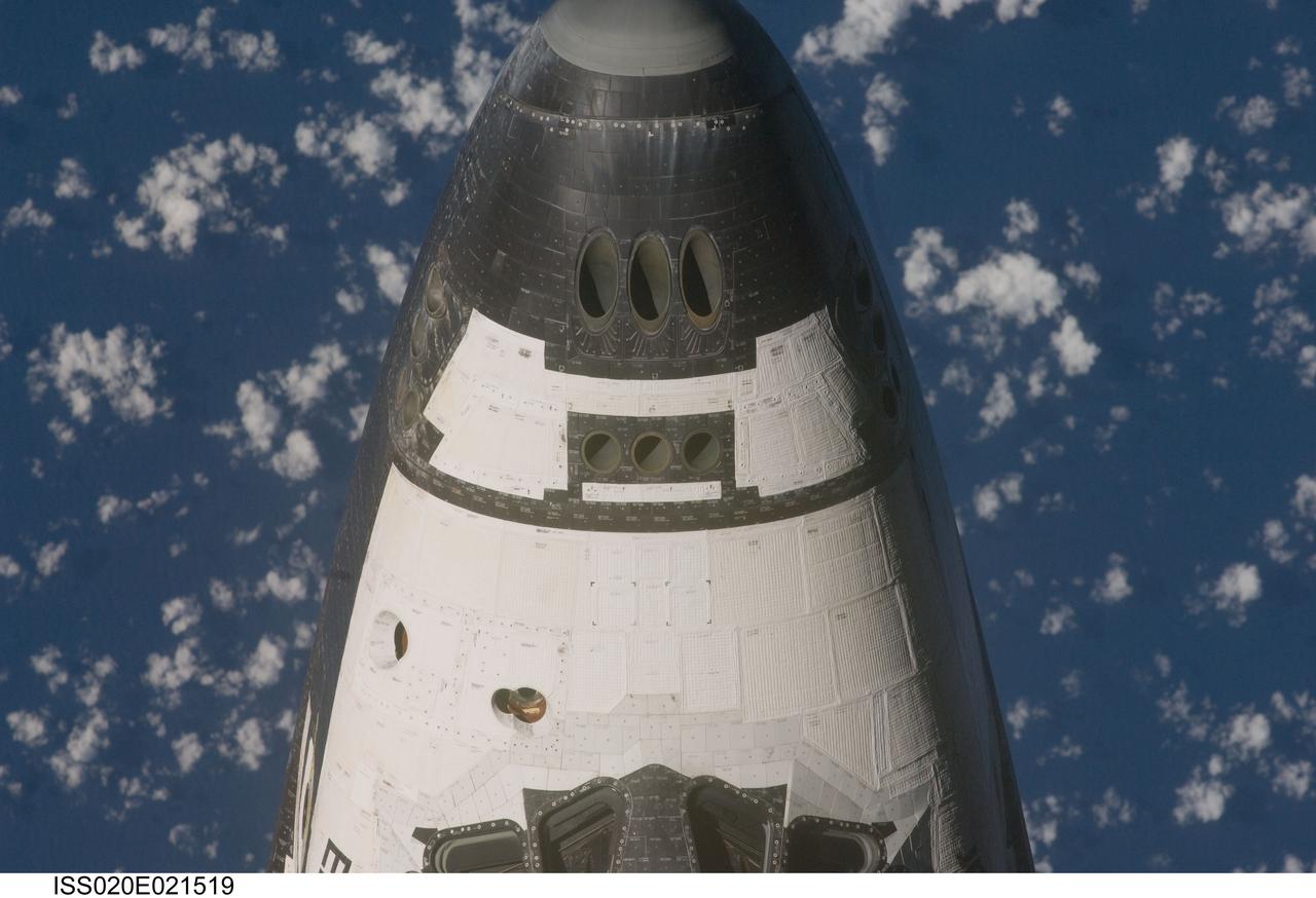 ISS020-E-021519 (17 July 2009) --- This view of the crew cabin of the Space Shuttle Endeavour was provided by an Expedition 20 crewmember during a survey of the approaching vehicle prior to docking with the International Space Station. As part of the survey and part of every mission's activities, Endeavour performed a back-flip for the rendezvous pitch maneuver (RPM). The image was photographed with a digital still camera, using a 400mm lens at a distance of about 600 feet (180 meters).