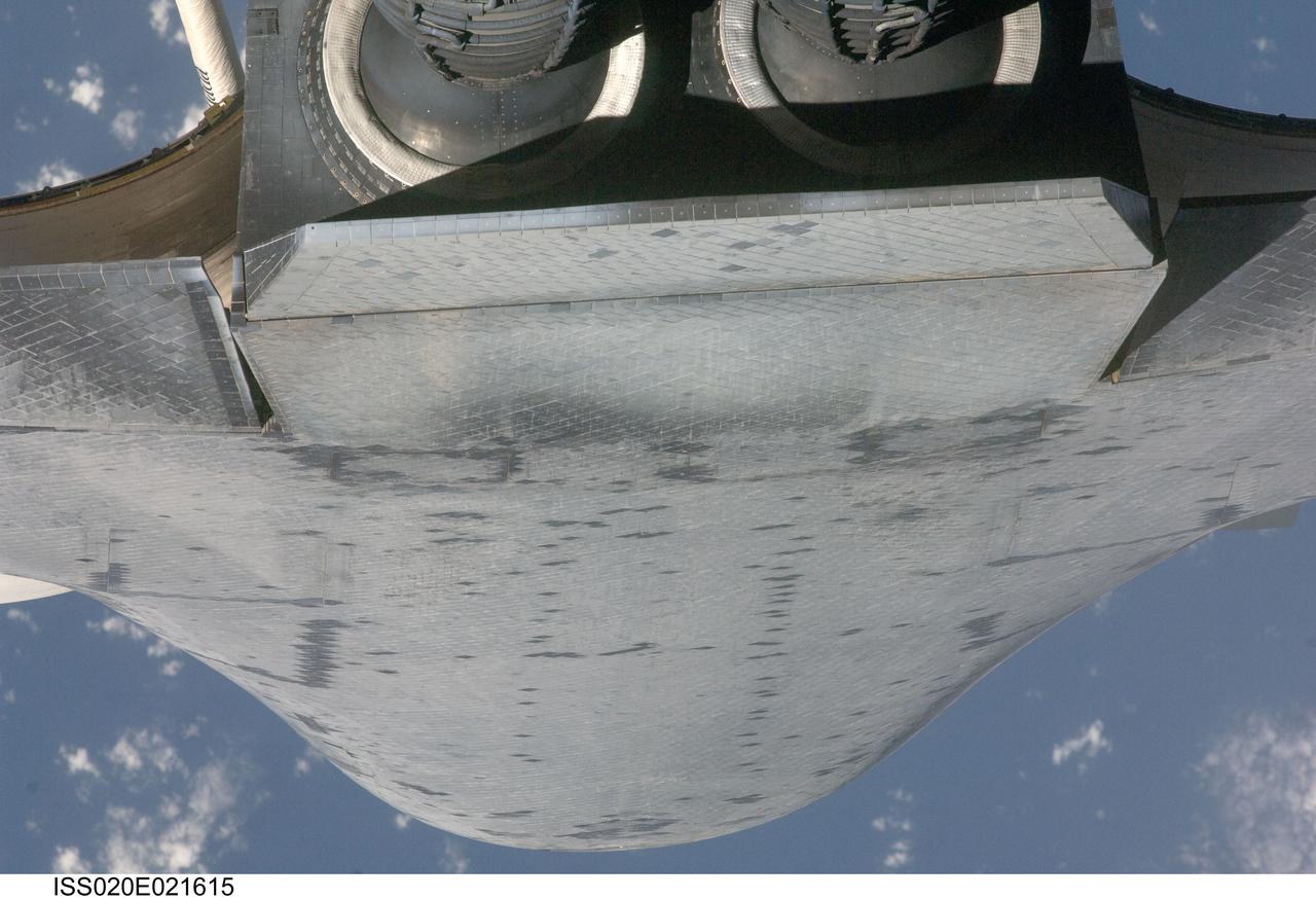 ISS020-E-021615 (17 July 2009) --- This view of the underside of the aft section of the space shuttle Endeavour was provided by an Expedition 20 crew member during a survey of the approaching vehicle prior to docking with the International Space Station. As part of the survey and part of every mission's activities, the STS-127 Endeavour crew performed a back-flip for the rendezvous pitch maneuver (RPM). The image was photographed with a digital still camera, using a 400mm lens at a distance of about 600 feet (180 meters).