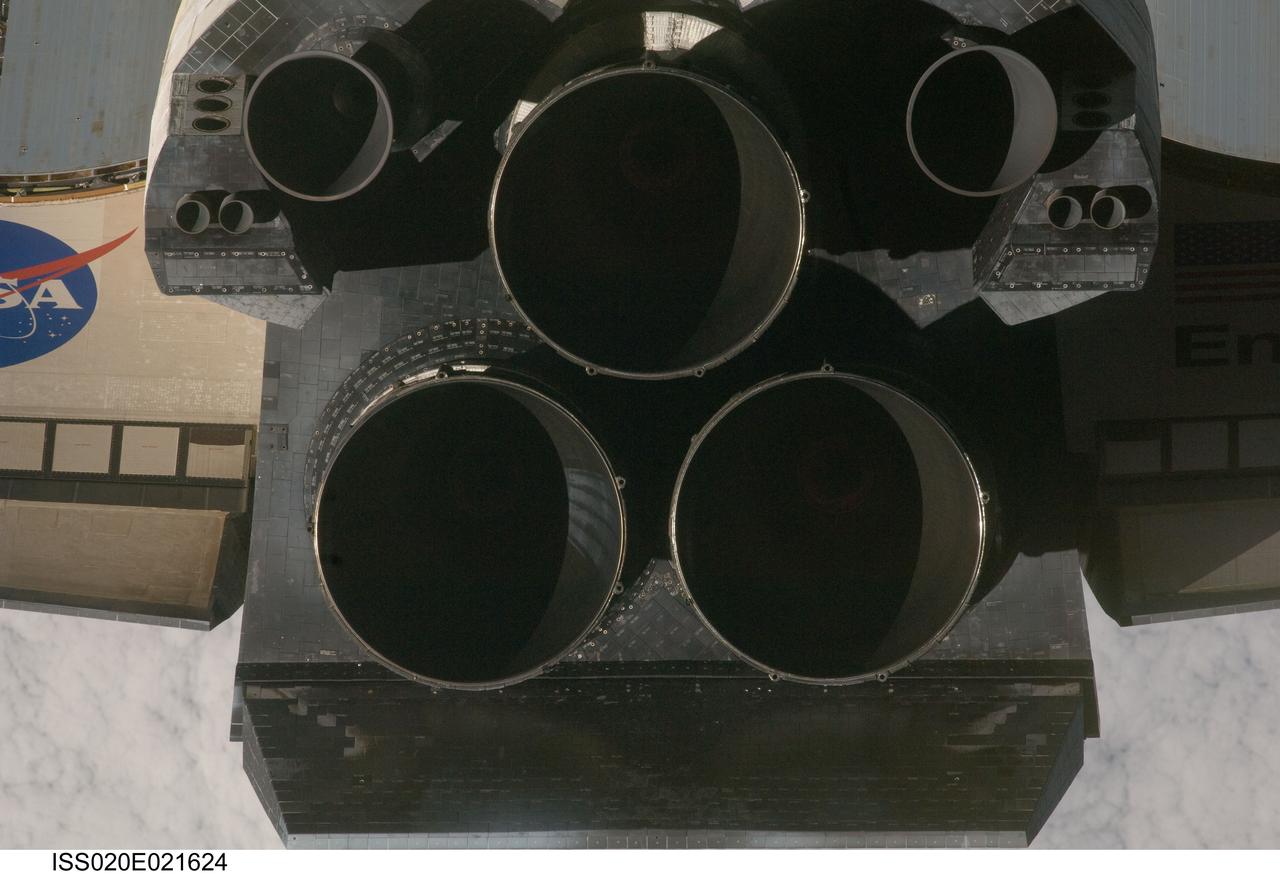 ISS020-E-021624 (17 July 2009) --- This view of the aft portion of the Space Shuttle Endeavour, including the three main engines and part of the wings, was provided by an Expedition 20 crewmember during a survey of the approaching vehicle prior to docking with the International Space Station. As part of the survey and part of every mission's activities, the STS-127 Endeavour crew performed a back-flip for the rendezvous pitch maneuver (RPM). The image was photographed with a digital still camera, using a 400mm lens at a distance of about 600 feet (180 meters).