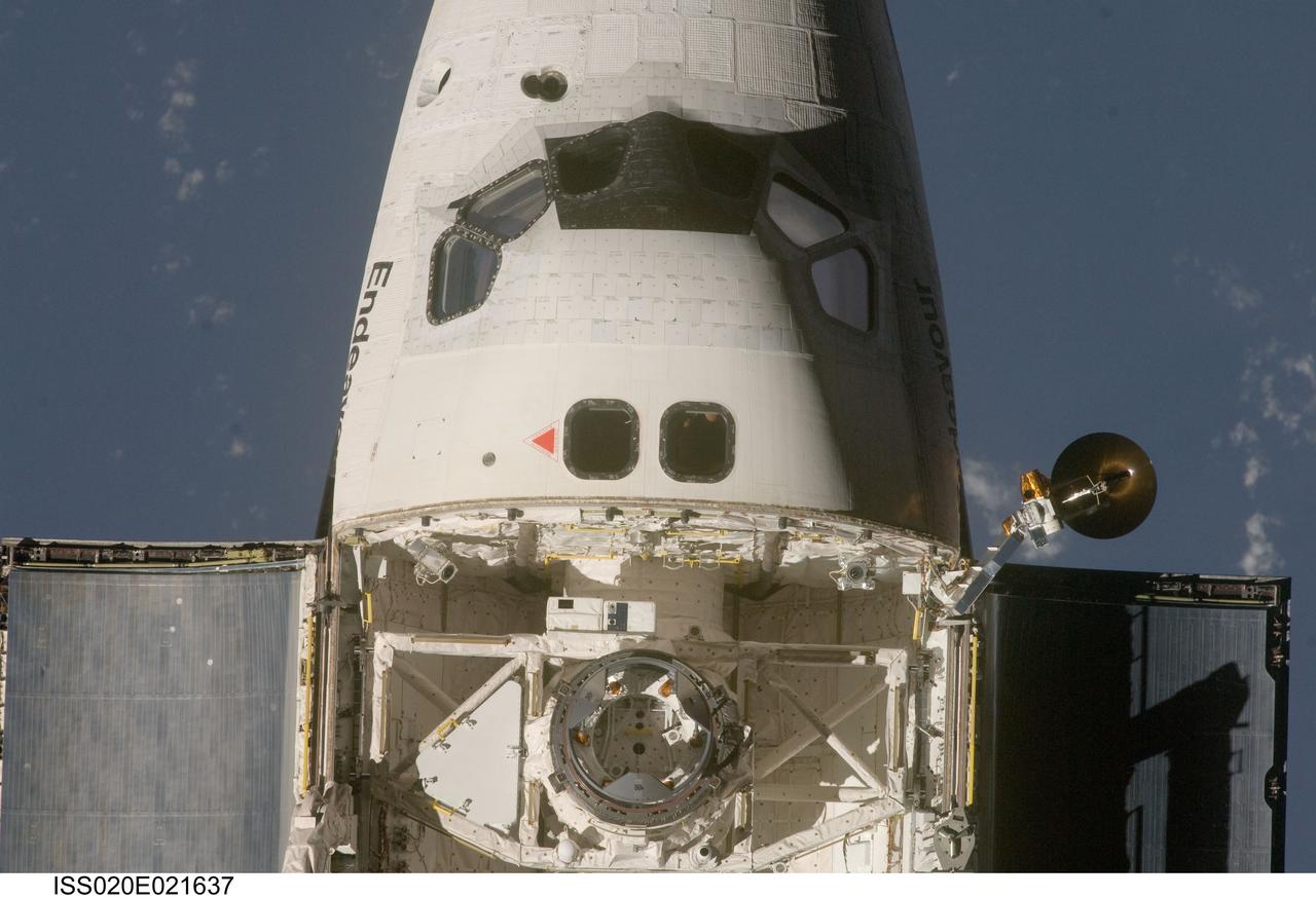 ISS020-E-021637 (17 July 2009) --- This view of the crew cabin and part of the forward cargo bay of the Space Shuttle Endeavour was provided by an Expedition 20 crewmember during a survey of the approaching STS-127 vehicle prior to docking with the International Space Station. As part of the survey and part of every mission's activities, Endeavour performed a back-flip for the rendezvous pitch maneuver (RPM). The image was photographed with a digital still camera, using a 400mm lens at a distance of about 600 feet (180 meters).