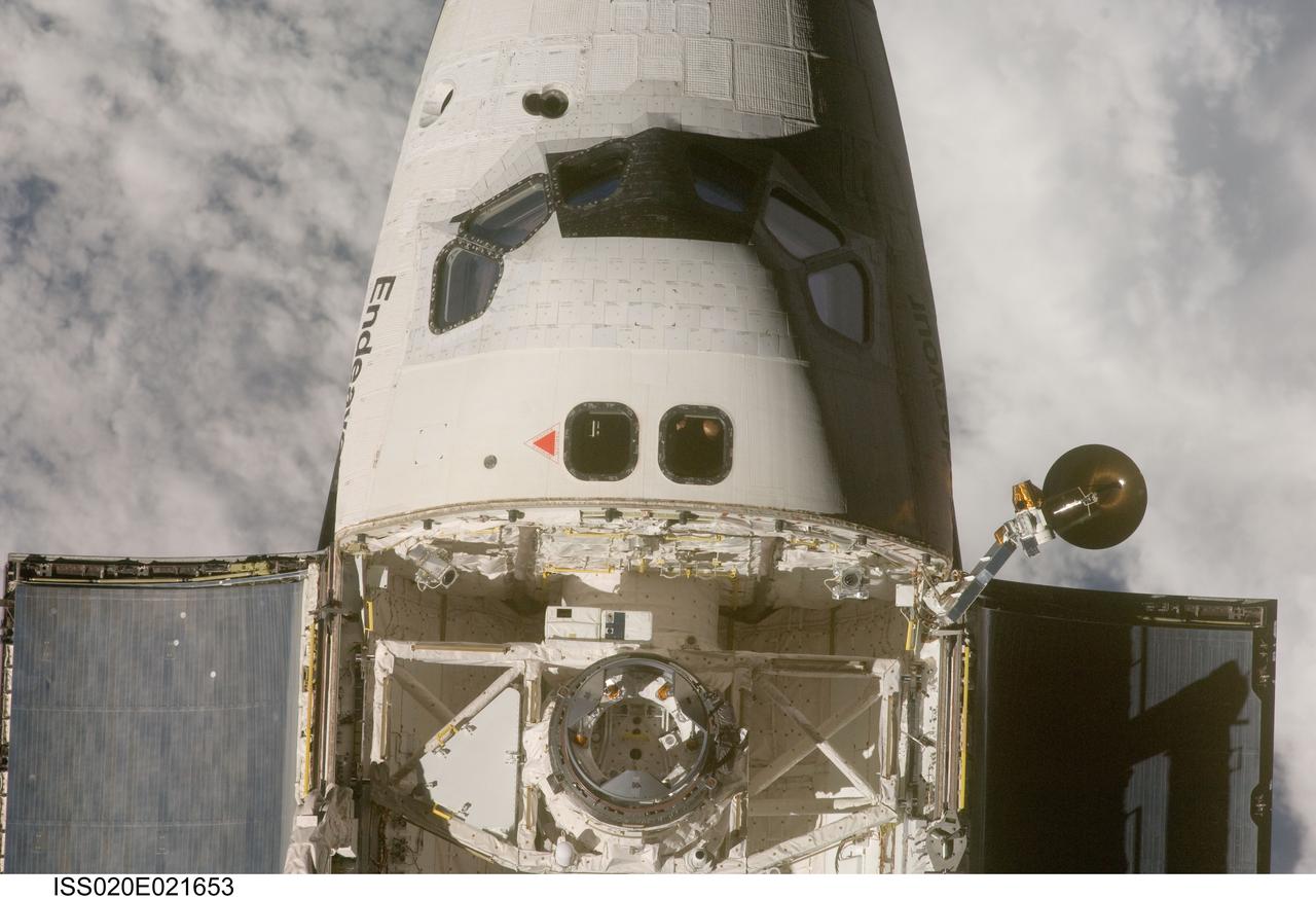 ISS020-E-021653 (17 July 2009) --- This view of the crew cabin and part of the cargo bay of the Space Shuttle Endeavour  was provided by an Expedition 20 crewmember during a survey of the approaching STS-127 vehicle before docking to the International Space Station. As part of the survey and part of every mission's activities, Endeavour performed a back-flip for the rendezvous pitch maneuver (RPM). The image was photographed with a digital still camera, using a 400mm lens at a distance of about 600 feet (180 meters).