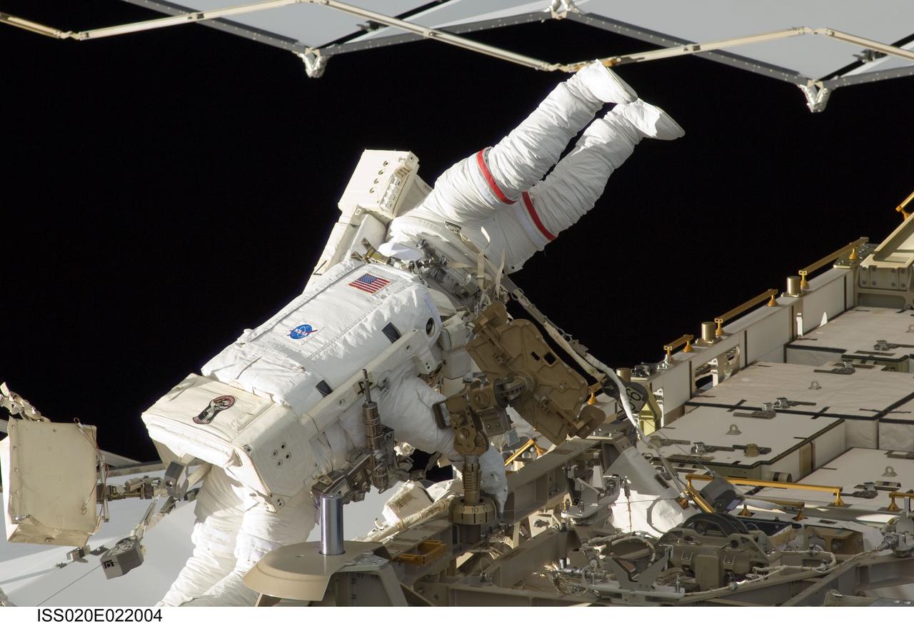 ISS020-E-022004 (18 July 2009) --- Astronauts Tim Kopra (left) and Dave Wolf kick off new work on the International Space Station with the first of five scheduled space walks, to be spread over the next several days.