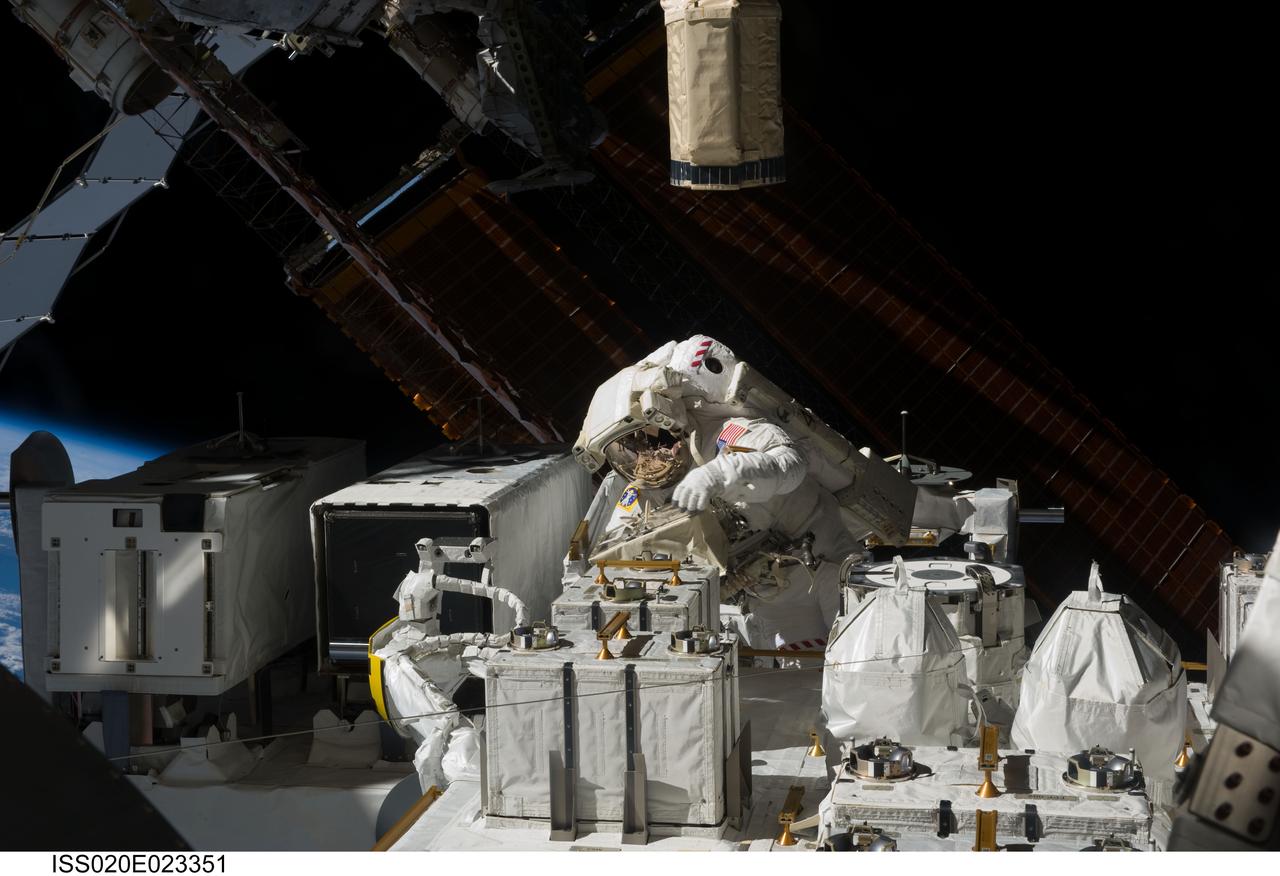 ISS020-E-023351 (22 July 2009) ---  Astronaut Christopher Cassidy, STS-127 mission specialist, handles the Japanese Experiment Module - Exposed Facility, which has been a major subject of attention by the joint crews aboard the International Space Station, currently docked with the Space Shuttle Endeavour. Flight day 8 on July 22 saw both hands-on and robotics work with the new hardware.