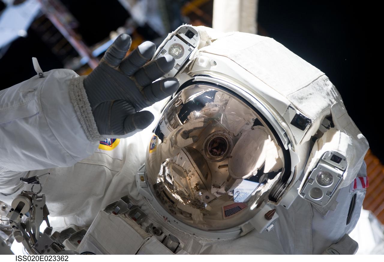 ISS020-E-023362 (22 July 2009) --- Astronaut Christopher Cassidy waves toward his spacewalking colleague, astronaut Dave Wolf, during the third session of extravehicular activity for the STS-127 crew to perform work, in cooncert with the Expedition 20 crew on the International Space Station.