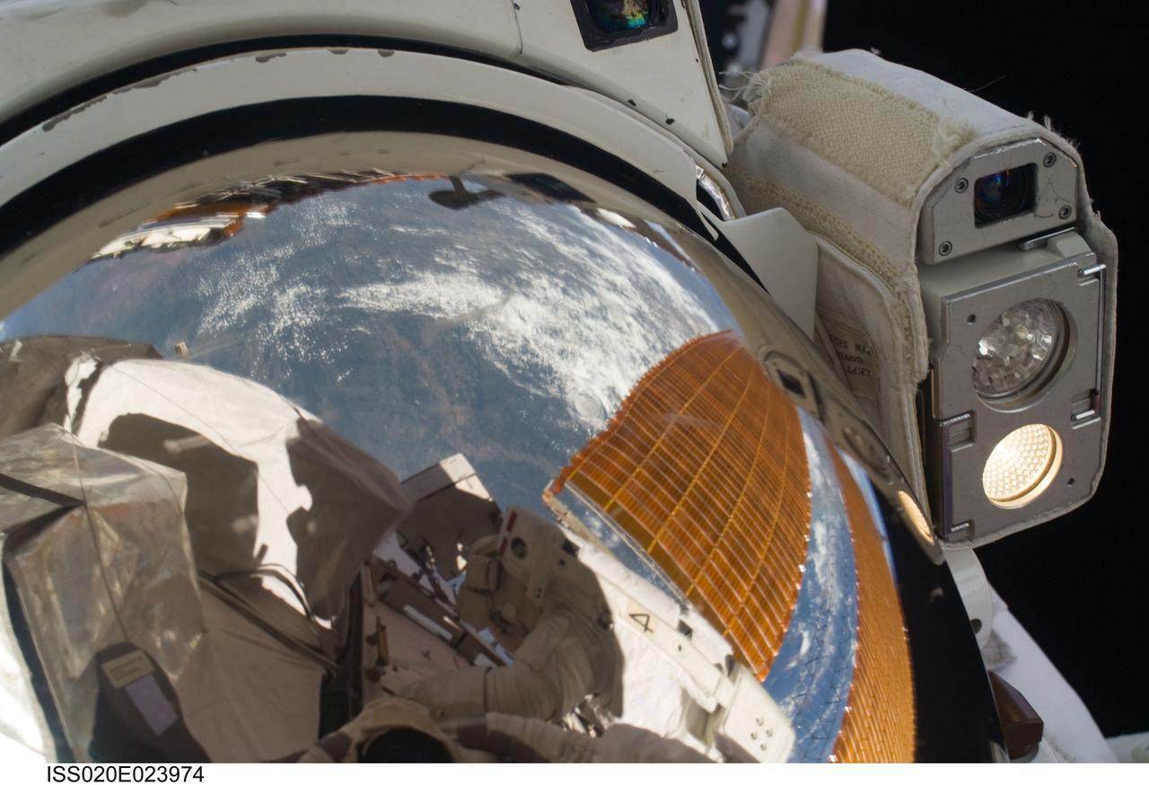 ISS020-E-023974 (24 July 2009) --- This is a close-up view of the helmet visor of astronaut Christopher Cassidy during his second spacewalk on July 24. Seen mirrored in the visor is astronaut Tom Marshburn, with whom Cassidy will team again on July 27 for the STS-127 crew's fifth and final session of extravehicular activity.  Eleven astronauts and cosmonauts remained inside the International Space Station and the shuttle to which it was docked, while the two suited astronauts continued work on the orbital outpost.