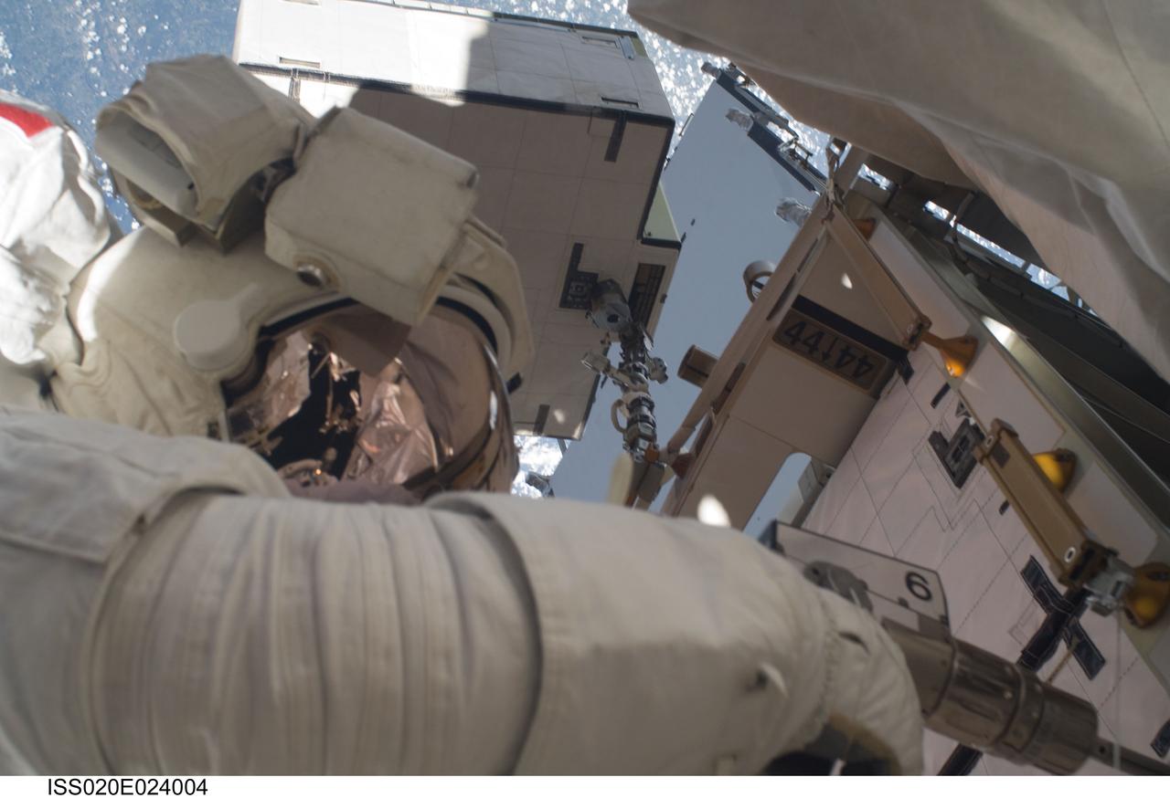 ISS020-E-024004 (24 July 2009) --- This is a close-up view of astronaut Tom Marshburn using a power tool during his second spacewalk on July 24. Out of frame is astronaut Christopher Cassidy with whom he'll team again on July 27 for the STS-127 crew's fifth and final session of extravehicular activity.  Eleven astronauts and cosmonauts remained inside the International Space Station and the shuttle to which it was docked, while the two suited astronauts continued work on the orbital outpost.