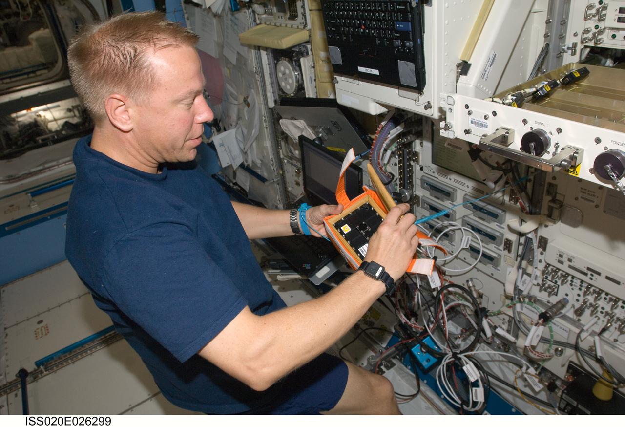 ISS020-E-026299 (29 July 2009) --- Astronaut Tim Kopra, Expedition 20 flight engineer, works at the Protein Crystallization Research Facility (PCRF) in the Kibo laboratory of the International Space Station.