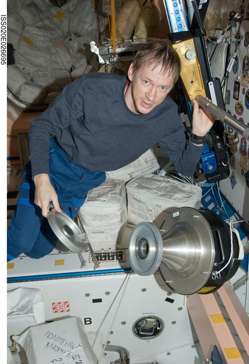 ISS020-E-026695 (31 July 2009) --- European Space Agency astronaut Frank De Winne, Expedition 20 flight engineer, works with a carbon dioxide removal kit adapter in the Unity node of the International Space Station.