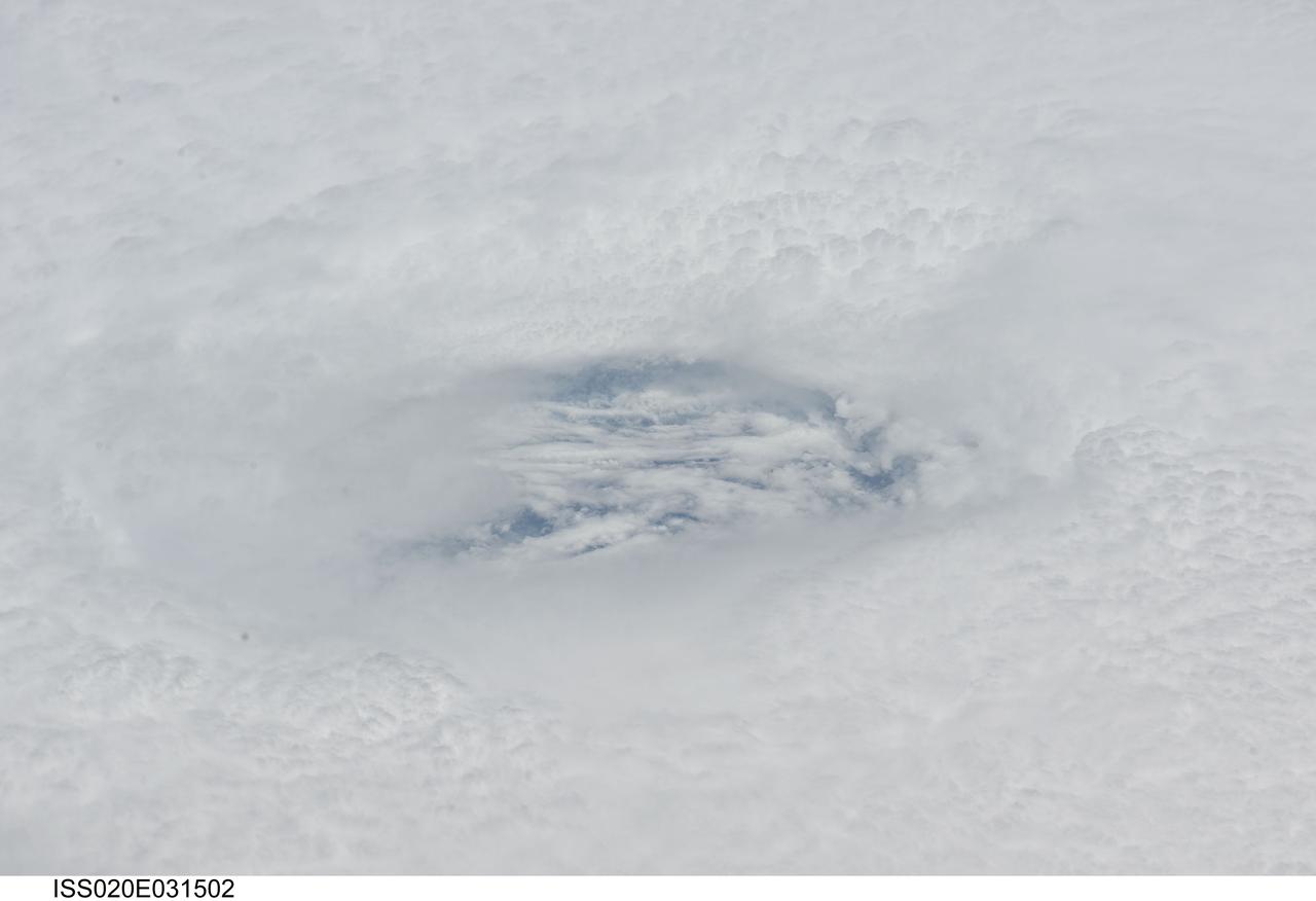 ISS020-E-031502 (18 Aug. 2009) --- Looking down the eye of Hurricane Bill in the Atlantic Ocean, an Expedition 20 crew member on the International Space Station captures a swirling cloud layer which is several thousand feet below the tops of the eye wall clouds. This view was taken on Aug. 18, 2009 at 16:10:07 GMT with a Nikkor 80-200mm zoom lens at the 200mm setting. At the time this photograph was taken, Hurricane Bill was centered at 15.9 degrees north latitude and 51.2 degrees west longitude, the winds were 90 knots (103.7 miles per hour) gusting to 110 knots (126.7 mph) and it was moving west-northwest (285 degrees) at 14 knots (16.1 mph).
