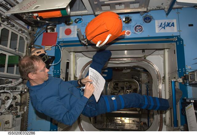 NASA image: De Winne with PFE and PBA equipment in JEM Pressurized Module (JPM)