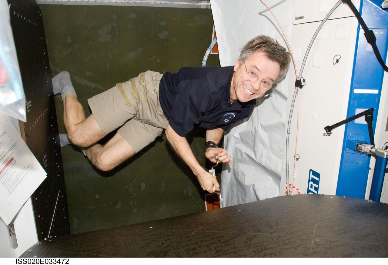 ISS020-E-033472 (21 Aug. 2009) --- Canadian Space Agency astronaut Robert Thirsk, Expedition 20 flight engineer, prepares to perform in-flight maintenance (IFM) on the oxygen generator system (OGS) rack in the Destiny laboratory of the International Space Station.