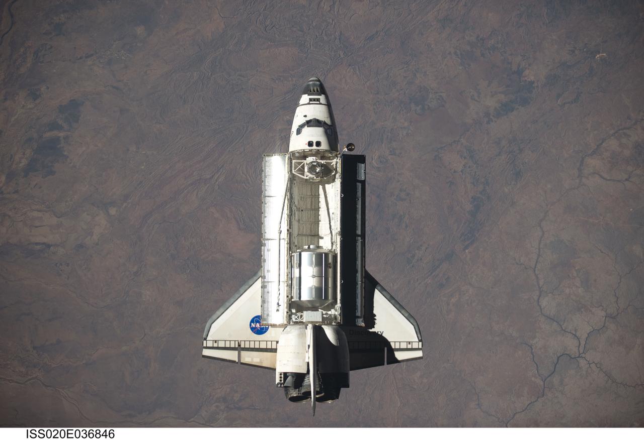 ISS020-E-036846 (30 Aug. 2009) --- Space Shuttle Discovery is featured in this image photographed by an Expedition 20 crew member as the shuttle approaches the International Space Station during STS-128 rendezvous and docking operations. Docking occurred at 7:54 p.m. (CDT) on Aug. 30, 2009. The Leonardo Multi-Purpose Logistics Module is visible in Discovery?s cargo bay.
