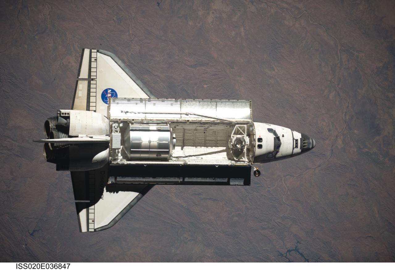 ISS020-E-036847 (30 Aug. 2009) --- Space Shuttle Discovery is featured in this image photographed by an Expedition 20 crew member as the shuttle approaches the International Space Station during STS-128 rendezvous and docking operations. Docking occurred at 7:54 p.m. (CDT) on Aug. 30, 2009. The Leonardo Multi-Purpose Logistics Module is visible in Discovery?s cargo bay.