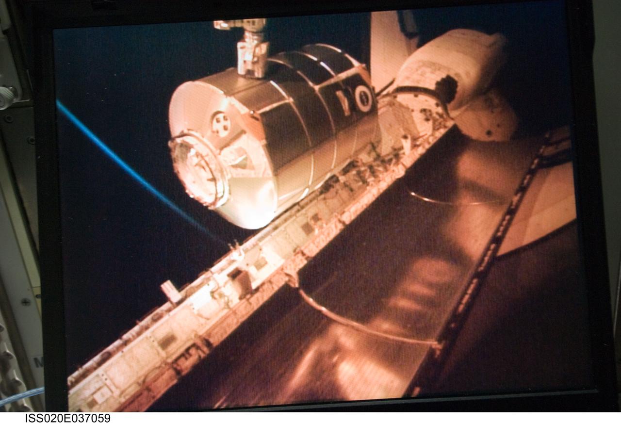 ISS020-E-037059 (31 Aug. 2009) --- Viewed from a computer monitor, the International Space Station’s robotic Canadarm2 unberths the Leonardo Multi-Purpose Logistics Module from Space Shuttle Discovery’s (STS-128) cargo bay for installation on the nadir port of the station’s Harmony node.