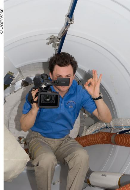 NASA image: Romanenko in front of PMA2 hatch