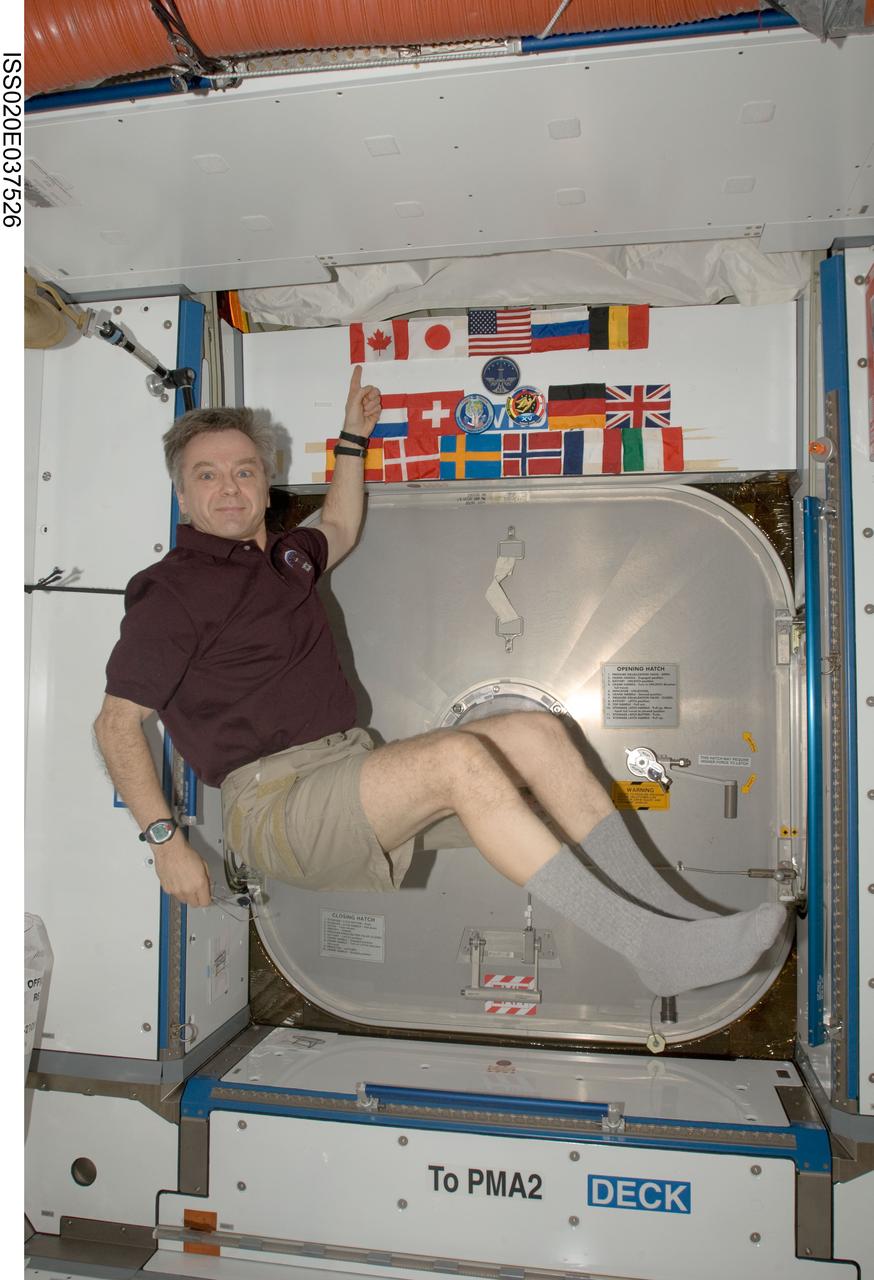 ISS020-E-037526 (15 Aug. 2009) --- Canadian Space Agency astronaut Robert Thirsk, Expedition 20 flight engineer, poses for a photo in the Harmony node of the International Space Station.