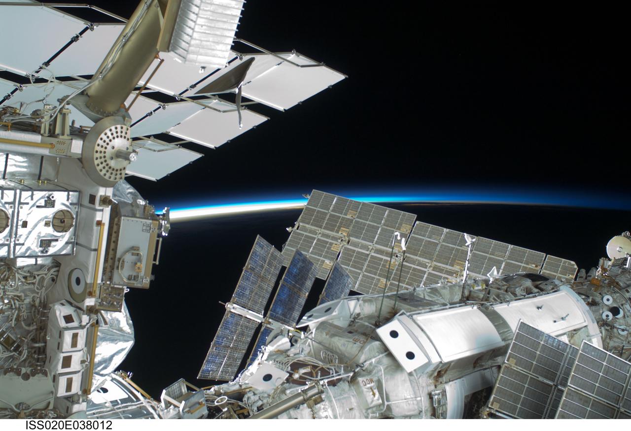 ISS020-E-038012 (3 Sept. 2009) --- A portion of the International Space Station is featured in this image photographed by a space walking astronaut during the STS-128 mission?s second session of extravehicular activity (EVA) as construction and maintenance continue on the station. The blackness of space and the thin line of Earth?s atmosphere provide the backdrop for the scene.