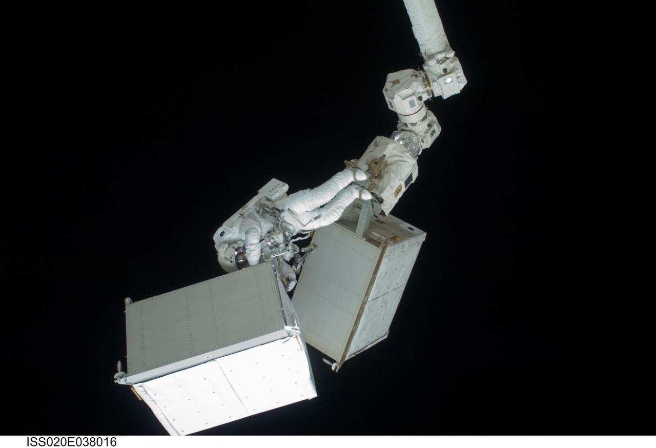 ISS020-E-038016 (3 Sept. 2009) --- Anchored to a Canadarm2 mobile foot restraint, European Space Agency astronaut Christer Fuglesang, STS-128 mission specialist, participates in the mission's second session of extravehicular activity (EVA) as construction and maintenance continue on the International Space Station. During the six-hour, 39-minute spacewalk, Fuglesang and NASA astronaut John ?Danny? Olivas (out of frame), mission specialist, installed the new Ammonia Tank Assembly on the Port 1 Truss and stowed the empty tank assembly into the Space Shuttle Discovery?s cargo bay.