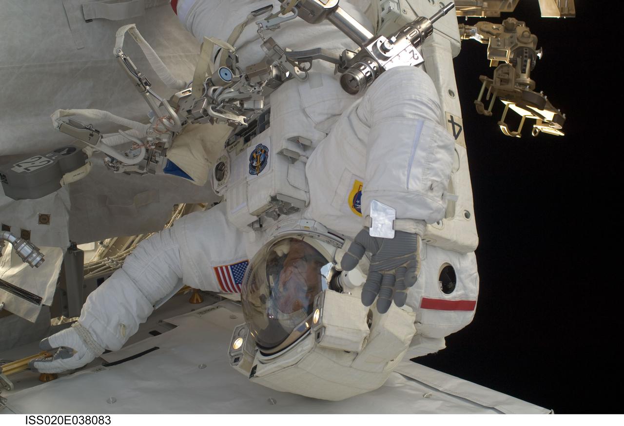 ISS020-E-038083 (3 Sept. 2009) --- NASA astronaut John ?Danny? Olivas, STS-128 mission specialist, participates in the mission's second session of extravehicular activity (EVA) as construction and maintenance continue on the International Space Station. During the six-hour, 39-minute spacewalk, Olivas and European Space Agency astronaut Christer Fuglesang (out of frame), mission specialist, installed the new Ammonia Tank Assembly on the Port 1 Truss and stowed the empty tank assembly into the Space Shuttle Discovery?s cargo bay.