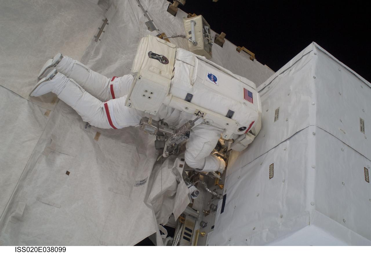 ISS020-E-038099 (3 Sept. 2009) --- NASA astronaut John ?Danny? Olivas, STS-128 mission specialist, participates in the mission's second session of extravehicular activity (EVA) as construction and maintenance continue on the International Space Station. During the six-hour, 39-minute spacewalk, Olivas and European Space Agency astronaut Christer Fuglesang (out of frame), mission specialist, installed the new Ammonia Tank Assembly on the Port 1 Truss and stowed the empty tank assembly into the Space Shuttle Discovery?s cargo bay.