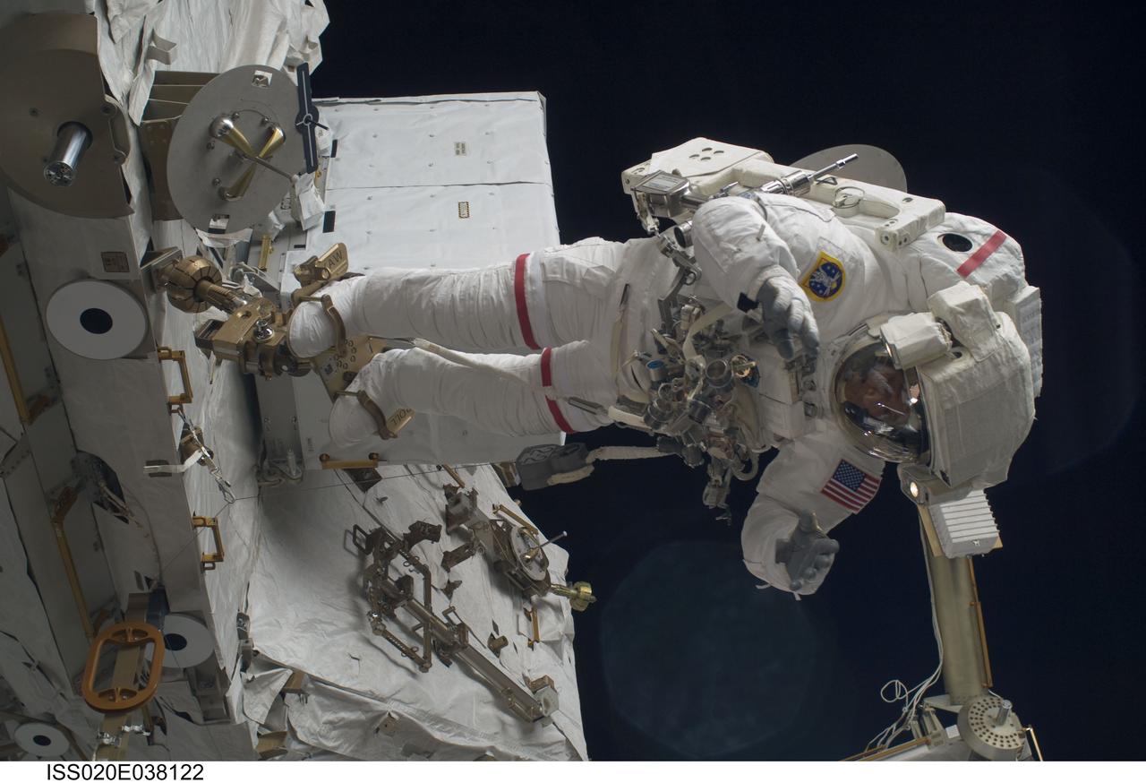 ISS020-E-038122 (3 Sept. 2009) --- NASA astronaut John ?Danny? Olivas, STS-128 mission specialist, participates in the mission's second session of extravehicular activity (EVA) as construction and maintenance continue on the International Space Station. During the six-hour, 39-minute spacewalk, Olivas and European Space Agency astronaut Christer Fuglesang (out of frame), mission specialist, installed the new Ammonia Tank Assembly on the Port 1 Truss and stowed the empty tank assembly into the Space Shuttle Discovery?s cargo bay.