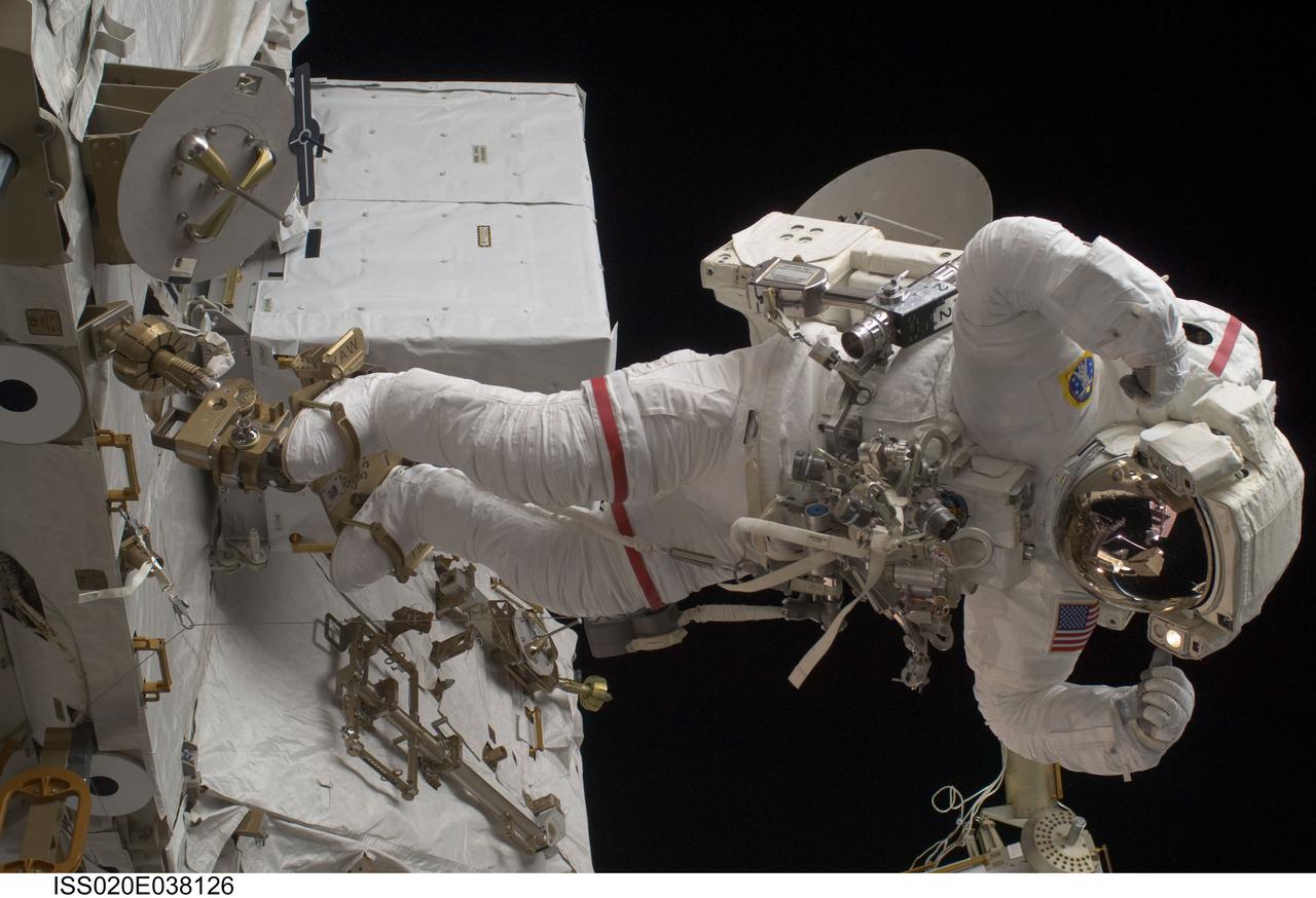 ISS020-E-038126 (3 Sept. 2009) --- NASA astronaut John ?Danny? Olivas, STS-128 mission specialist, participates in the mission's second session of extravehicular activity (EVA) as construction and maintenance continue on the International Space Station. During the six-hour, 39-minute spacewalk, Olivas and European Space Agency astronaut Christer Fuglesang (out of frame), mission specialist, installed the new Ammonia Tank Assembly on the Port 1 Truss and stowed the empty tank assembly into the Space Shuttle Discovery?s cargo bay.