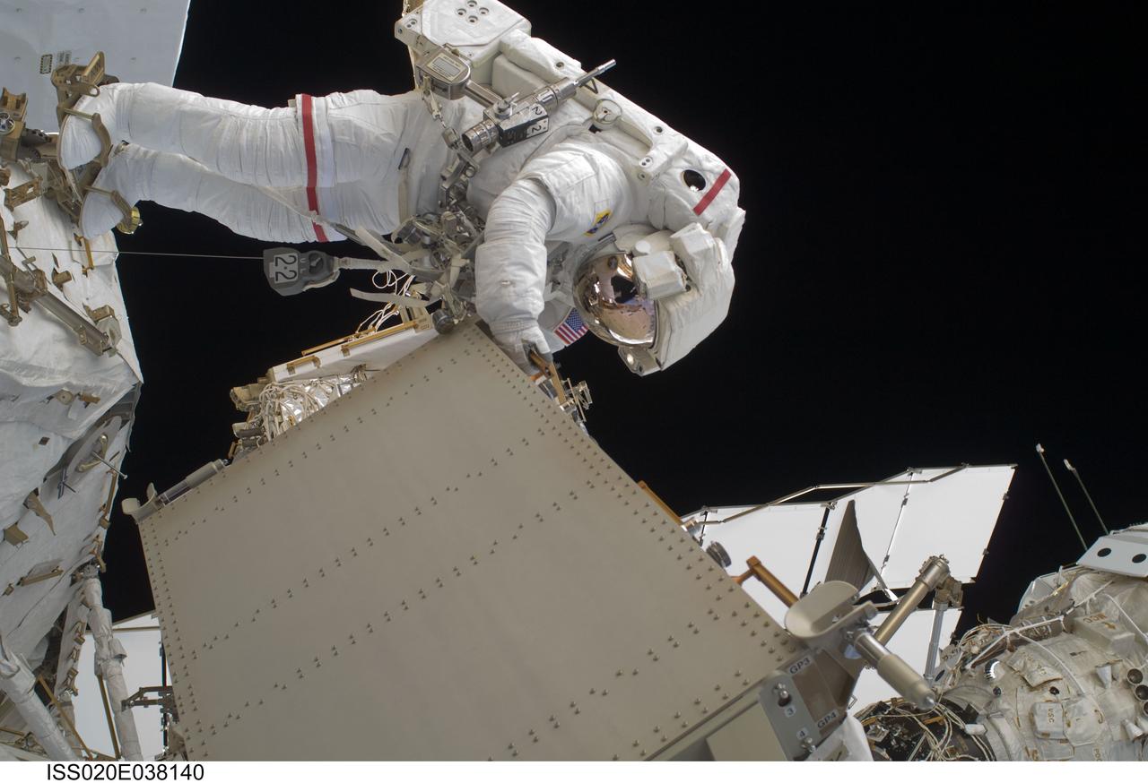 ISS020-E-038140 (3 Sept. 2009) --- NASA astronaut John ?Danny? Olivas, STS-128 mission specialist, participates in the mission's second session of extravehicular activity (EVA) as construction and maintenance continue on the International Space Station. During the six-hour, 39-minute spacewalk, Olivas and European Space Agency astronaut Christer Fuglesang (out of frame), mission specialist, installed the new Ammonia Tank Assembly on the Port 1 Truss and stowed the empty tank assembly into the Space Shuttle Discovery?s cargo bay.