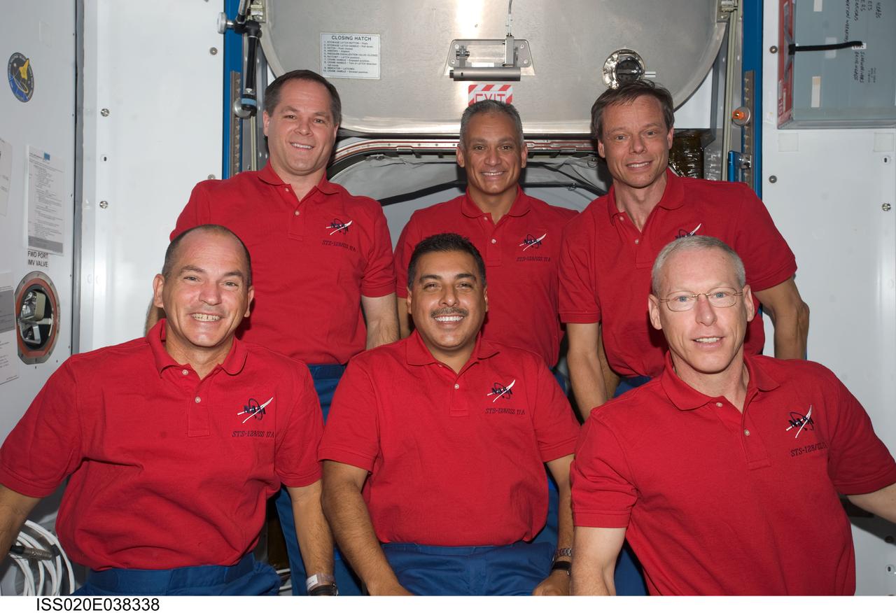 ISS020-E-038338 (5 Sept. 2009) --- The STS-128 crewmembers found a few moments on a day between two spacewalk days to pose for some portraits on the International Space Station. Pictured on the front row, from the left, are astronauts Rick Sturckow, commander, Jose Hernandez and Patrick Forrester, both mission specialists. In the back, from left, are astronauts Kevin Ford, pilot, and John "Danny" Olivas, with European Space Agency astronaut Christer Fuglesang, both mission specialists.